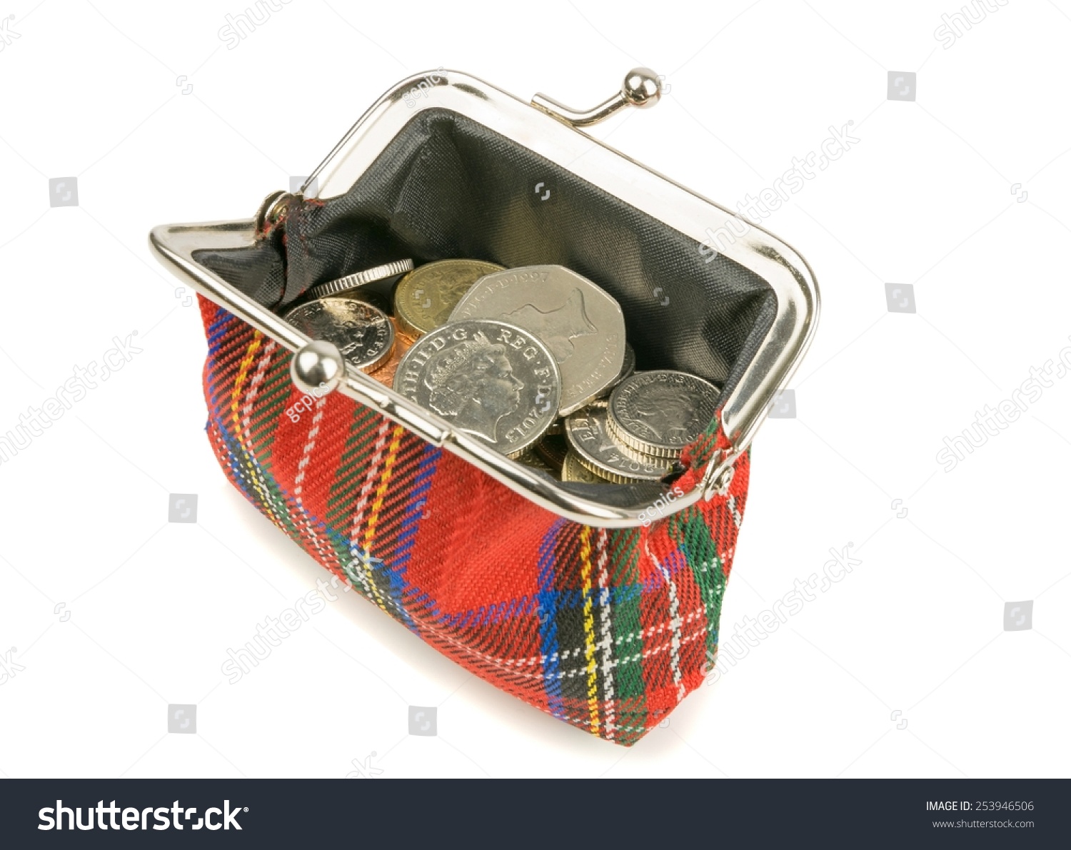 An Open Purse Full Of British Money Coins On A White Background Stock