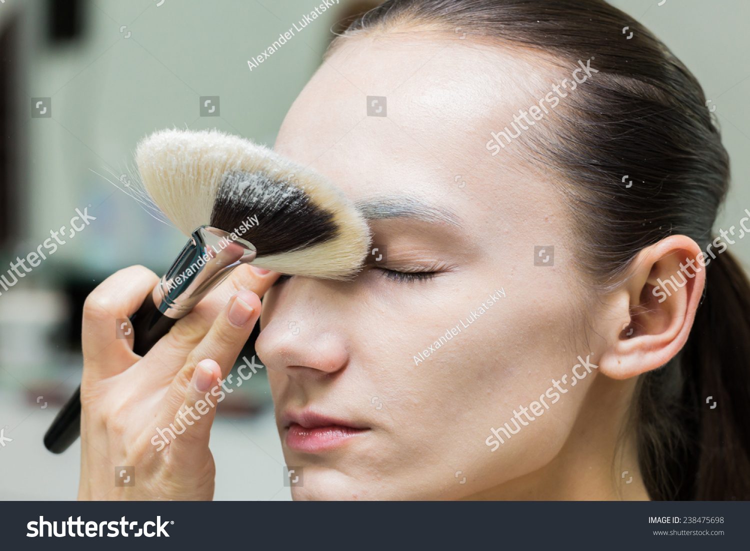 Application Of Powder On The Model S Face Makeup Artist In A Beauty Salon Doing Make Up Special