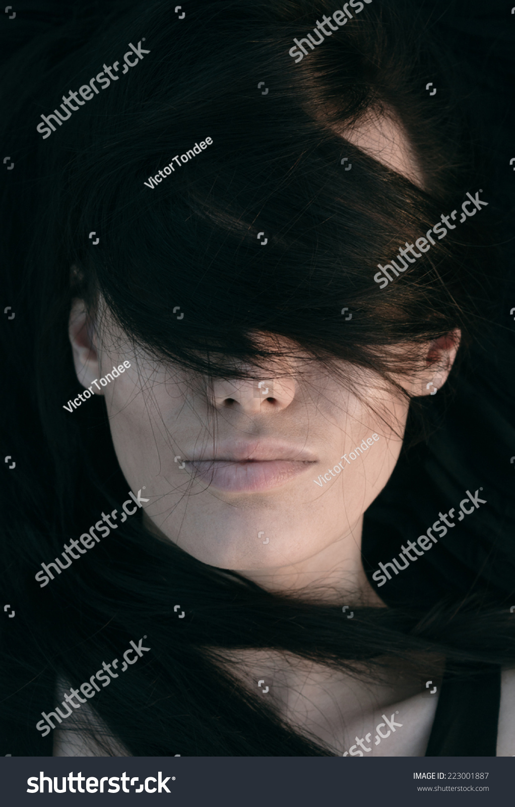 Artistic Head And Shoulders Portrait Of A Young Woman With Her Long