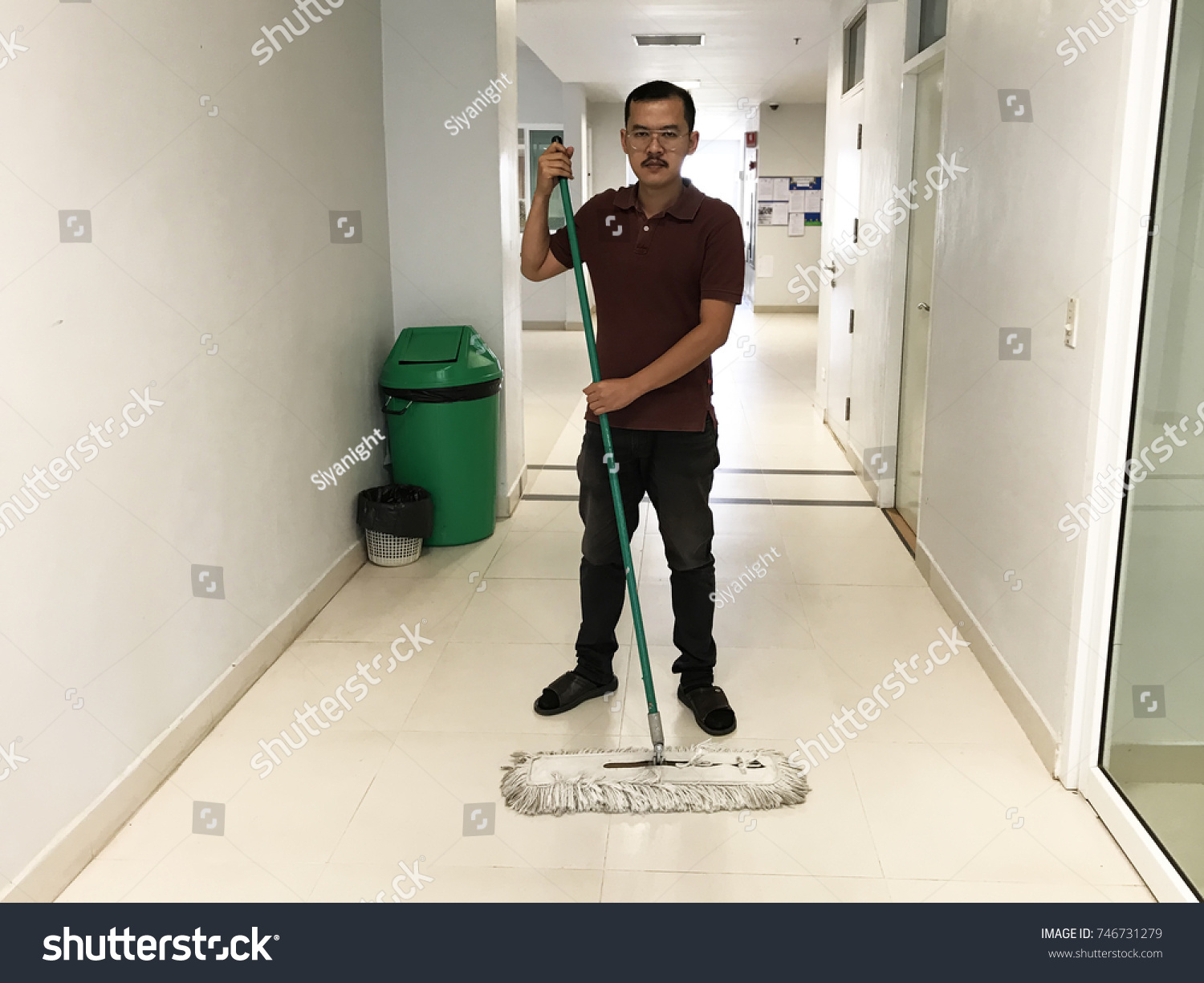 Asian Male Janitor Mopping Floor Hallway Stock Photo Edit Now 746731279