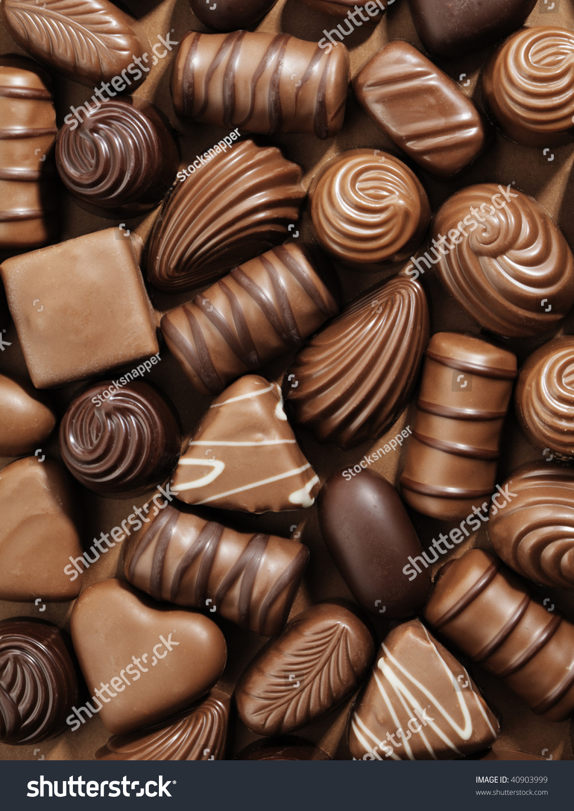 Assorted Chocolate Pralines On Brown Background Stock Photo 40903999