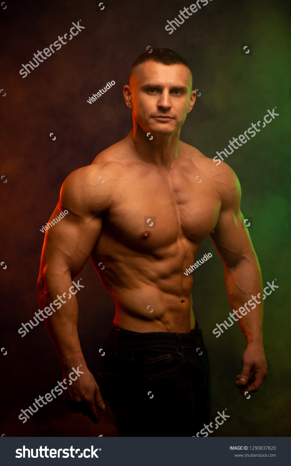 Athletic Shirtless Male Model Flexing Muscles