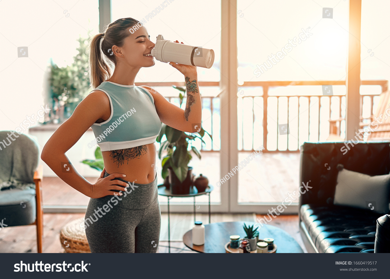 Athletic Woman Sportswear Drinking Protein Shake Stock Photo