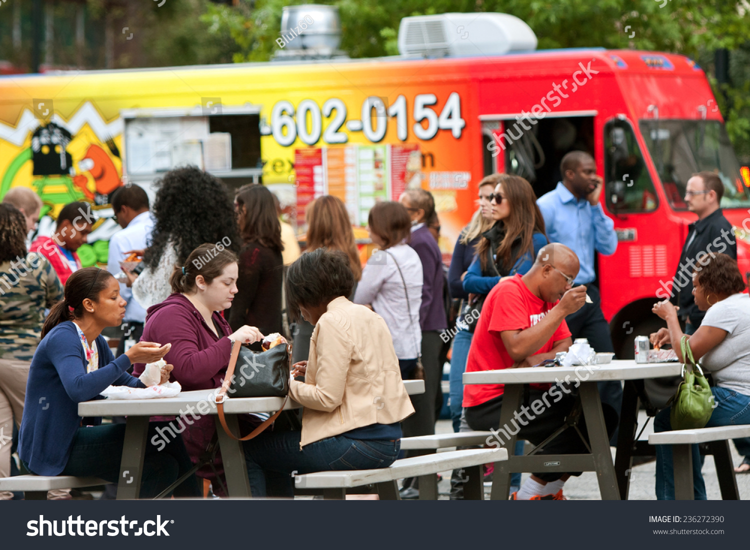 ATLANTA GA OCTOBER 16 Customers sit and eat meals from popular food trucks during their lunch hour at Food Truck Thursday on October 16 2014 in Atlanta ATLANTA GA OCTOBER 16 Customers sit and eat meals from popular food trucks during their lunch hour at Food Truck Thursday on October 16 2014 in Atlanta