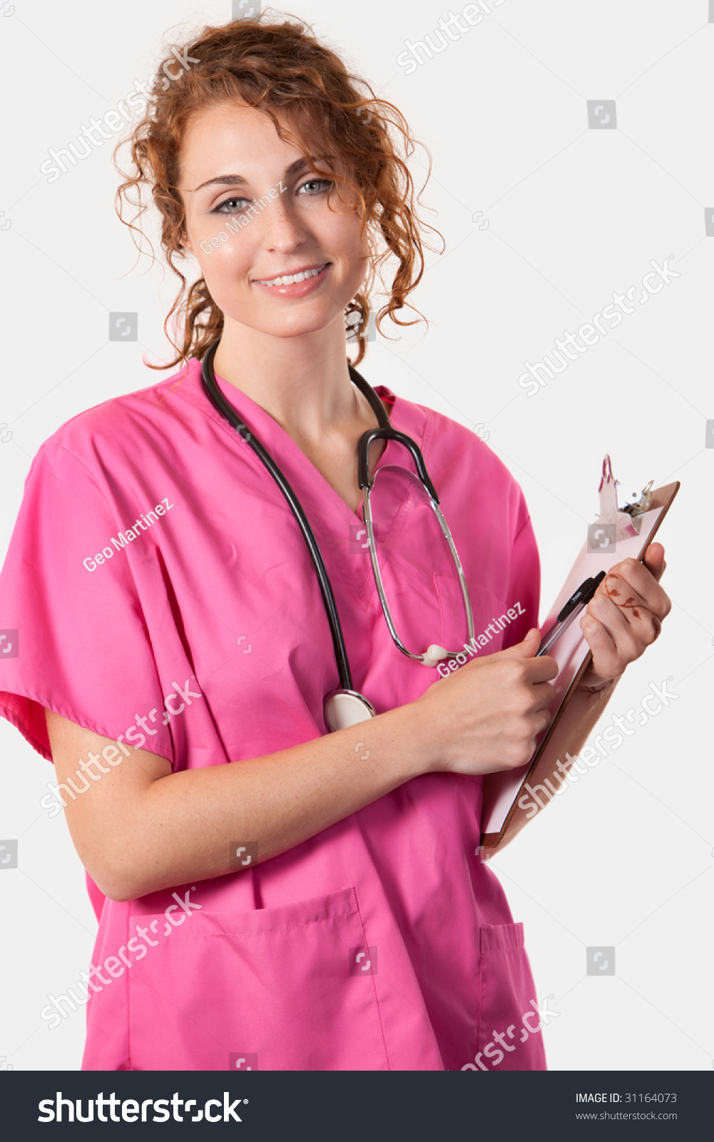 Attractive Friendly Smiling Curly Hair Female Nurse In