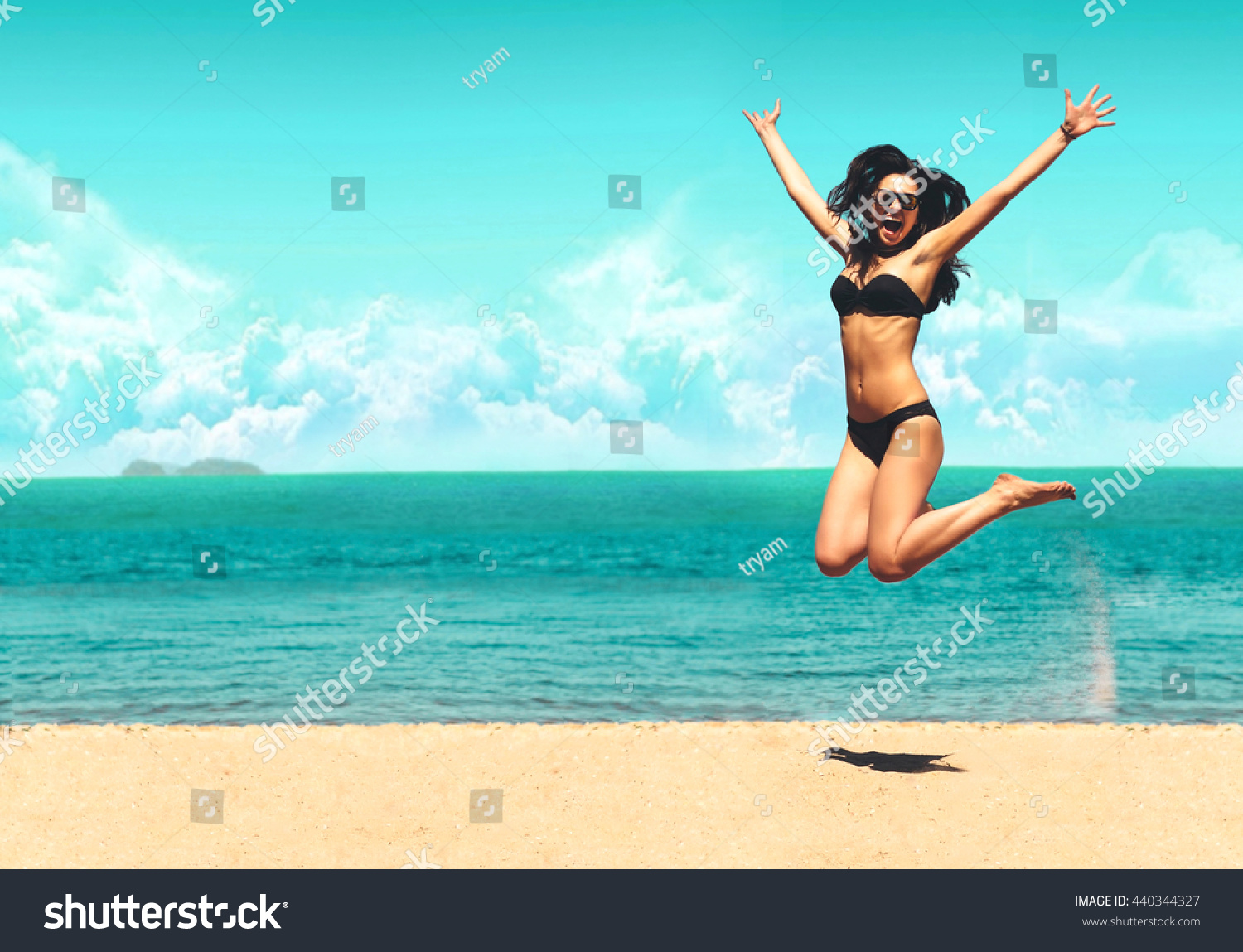 Attractive Girl Bikini Jumping On Beach Stock Photo