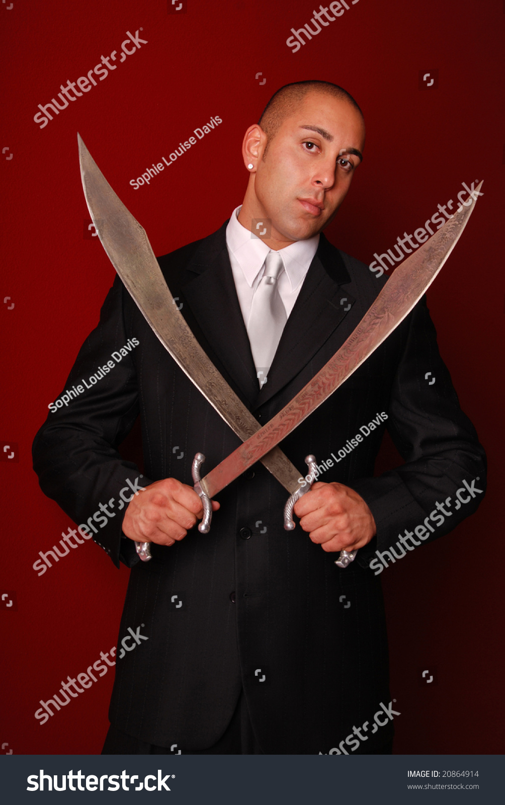 Attractive Man Holding Two Samurai Swords Stock Photo