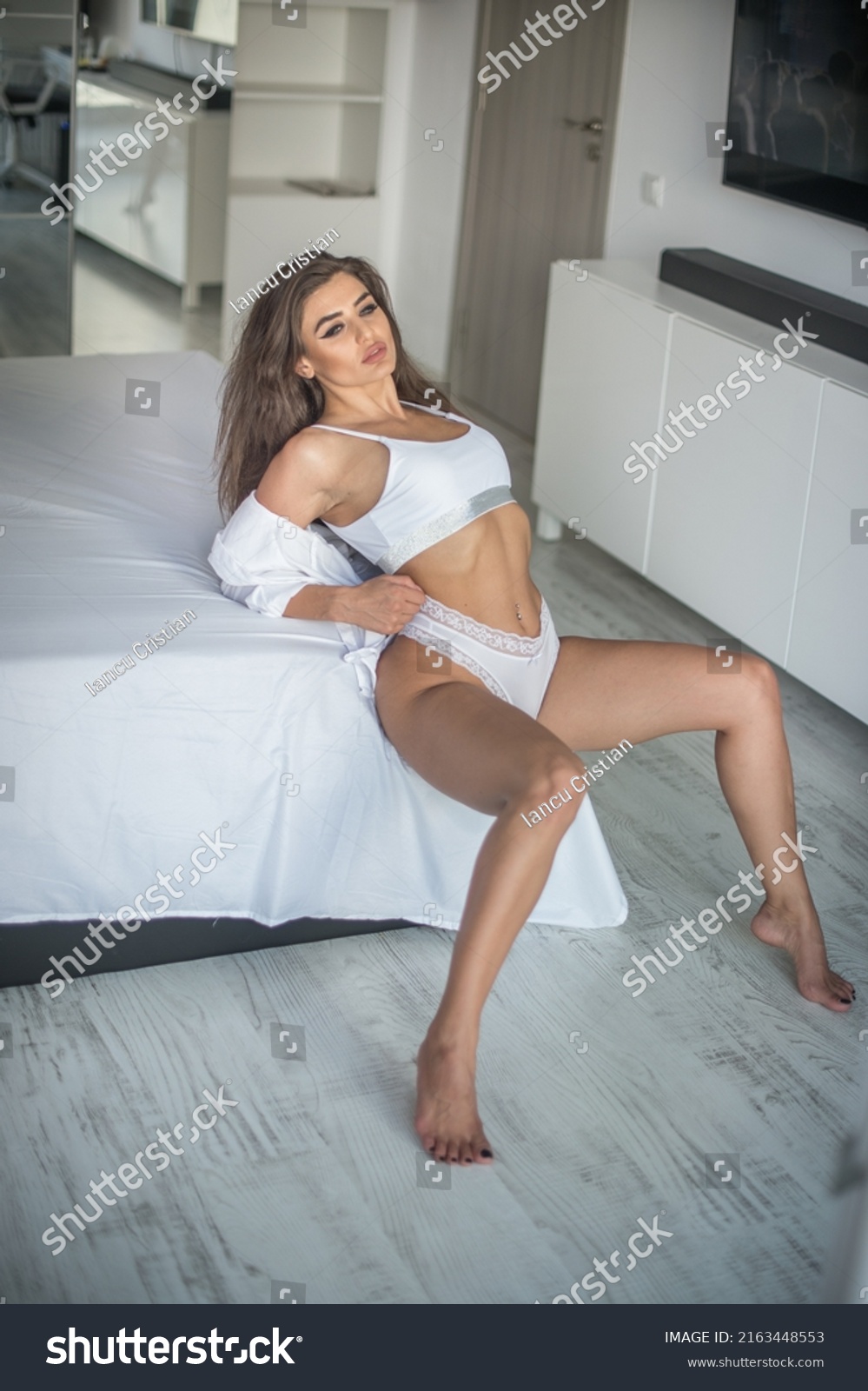 Attractive Sexy Brunette White Lingerie Posing Stock Photo