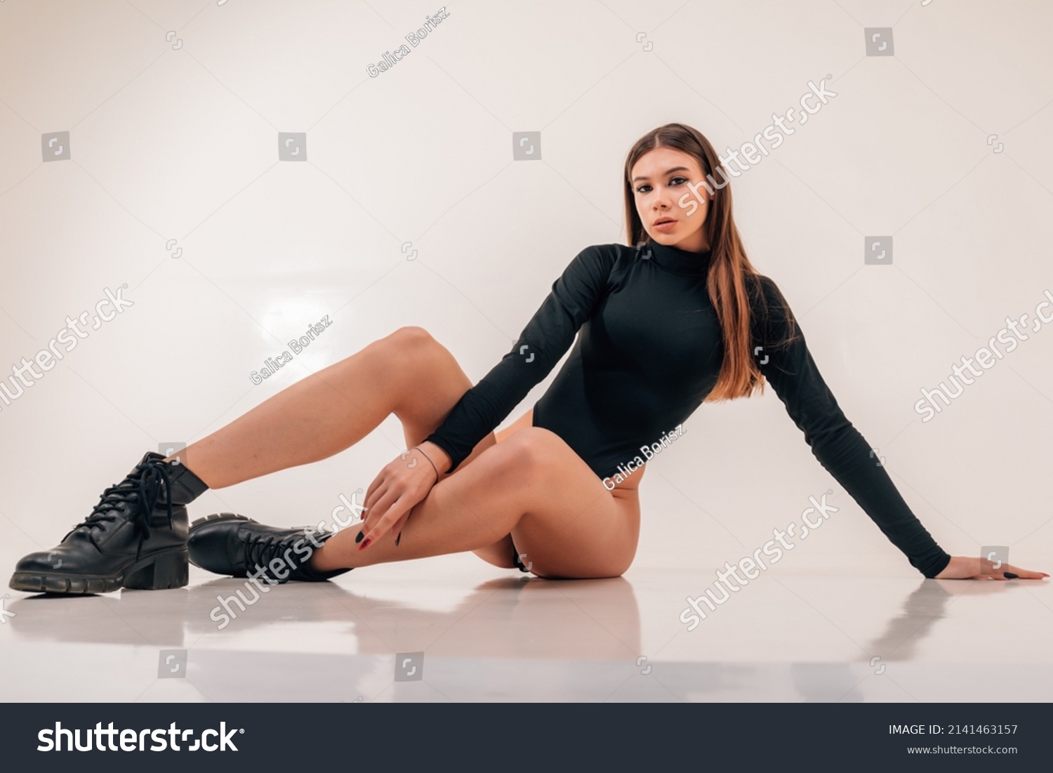 Attractive Tanned Brunette Black Underwear Sit Stock Photo