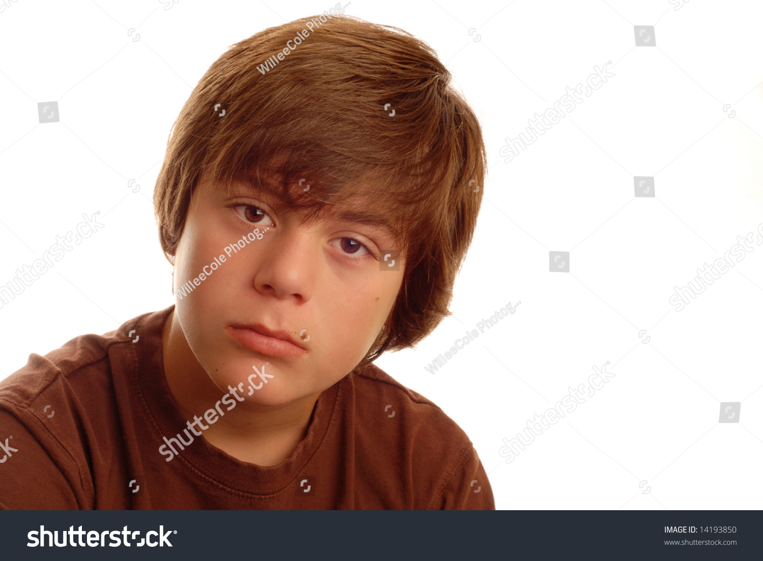 Attractive Thirteen Year Old Boy With Thoughtful Expression Isolated On