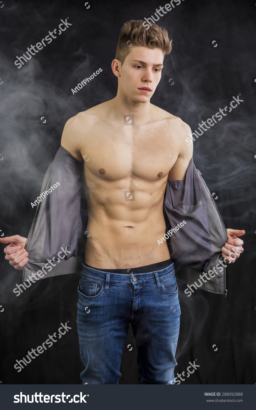 Attractive Trendy Athletic Fit Young Man Undressing, Taking Off T-Shirt ...