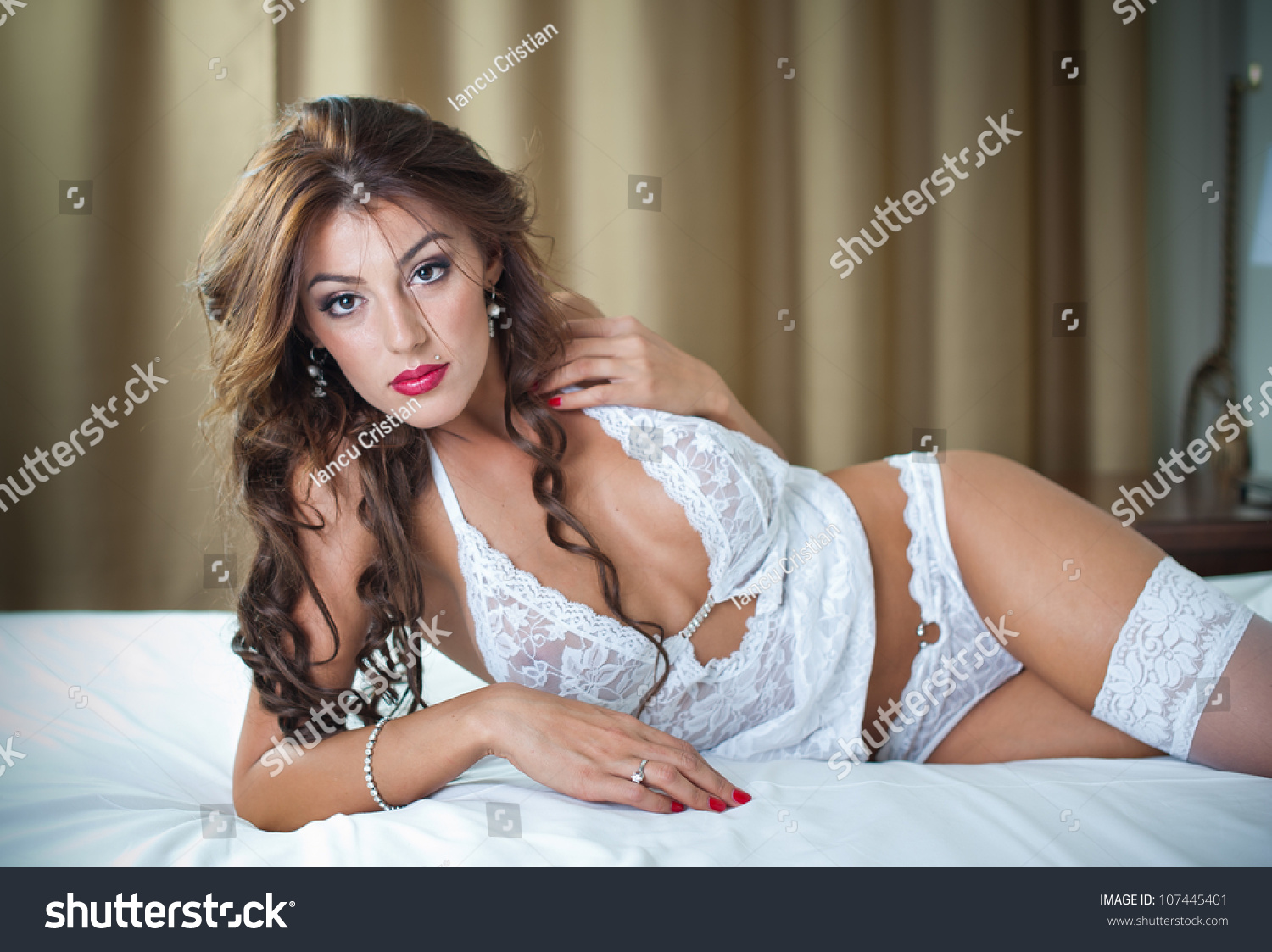 Attractive Woman Sexy White Lingerie Lying Foto Stock