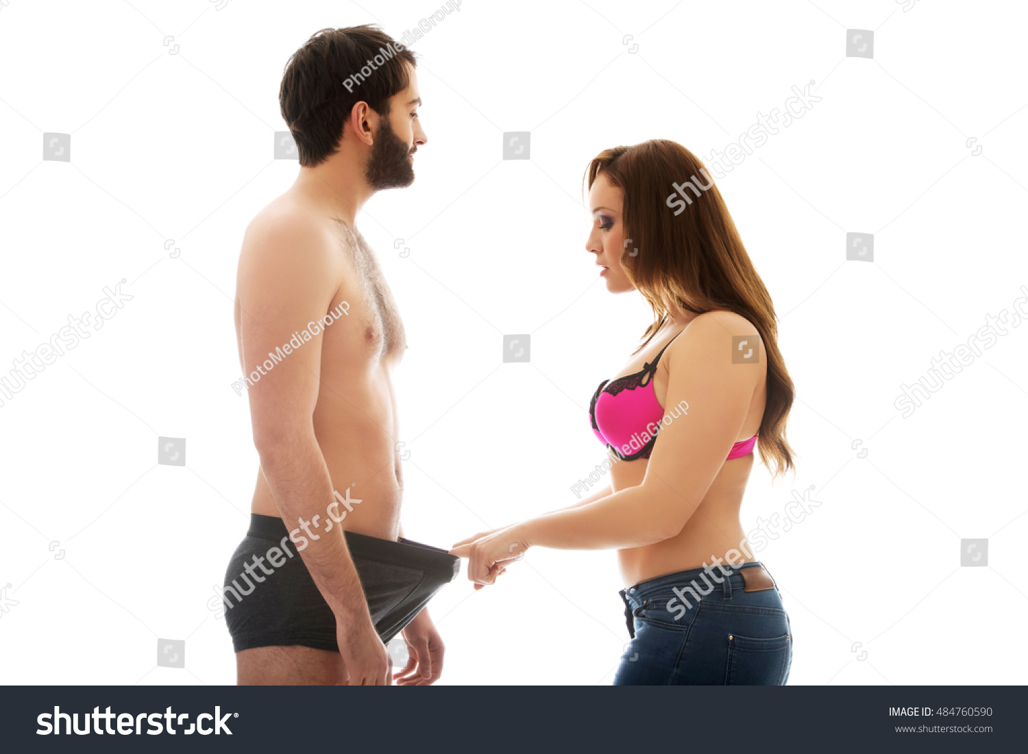 Attractive Woman Looking Into Mans Panties Stock Photo