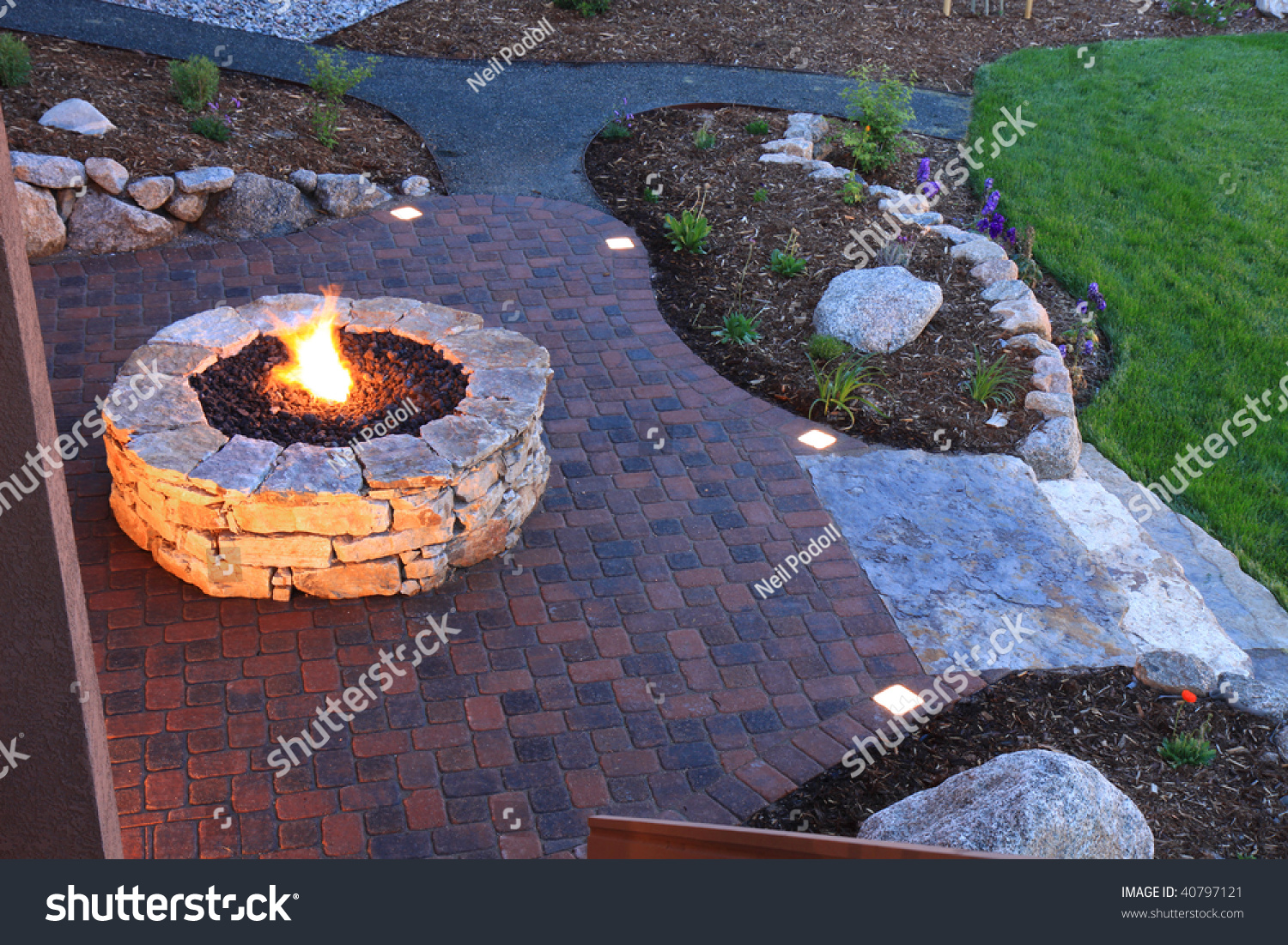 Awesome Backyard With Fire Pit And Illuminated Paver Patio ...