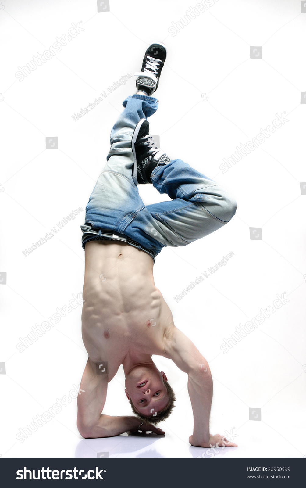 B-Boy Dancer Standing Upside Down On His Hands One Knee Bent Stock ...