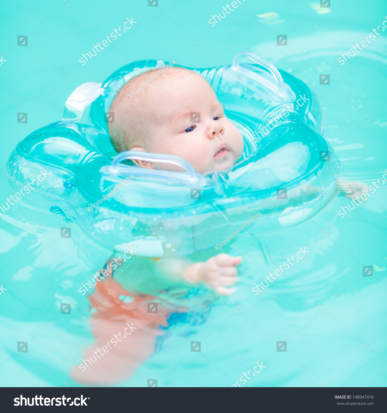 baby swimming with neck ring