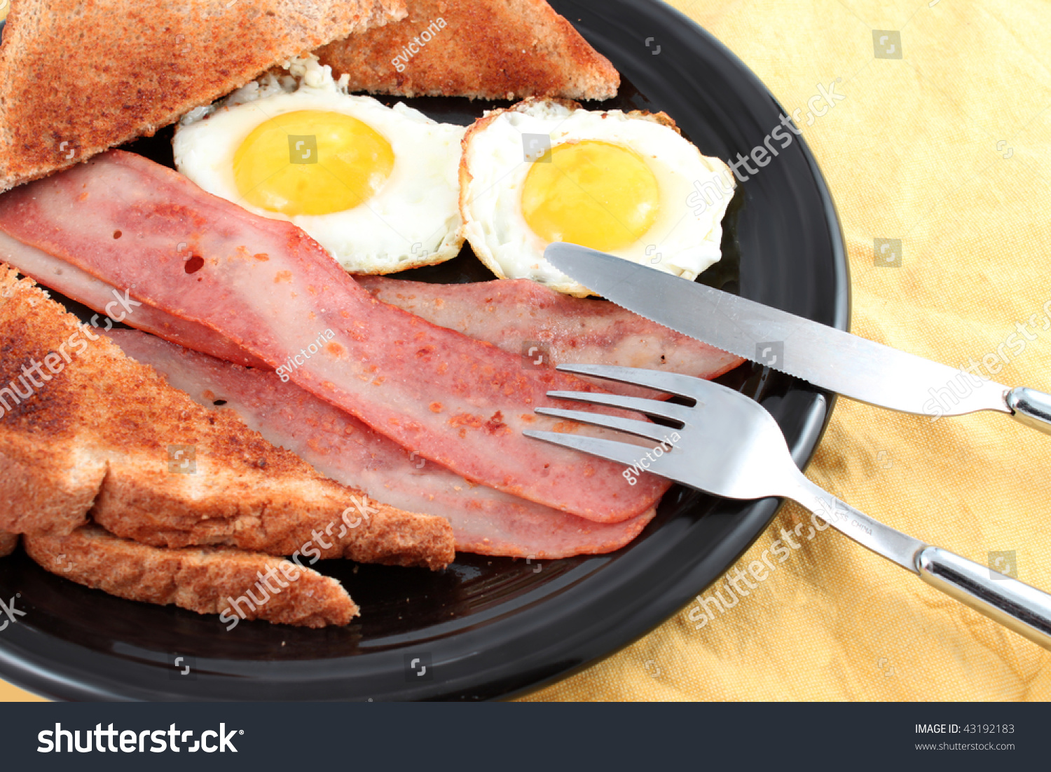 Bacon Buttered Toast And Fried Eggs For Breakfast Stock Photo