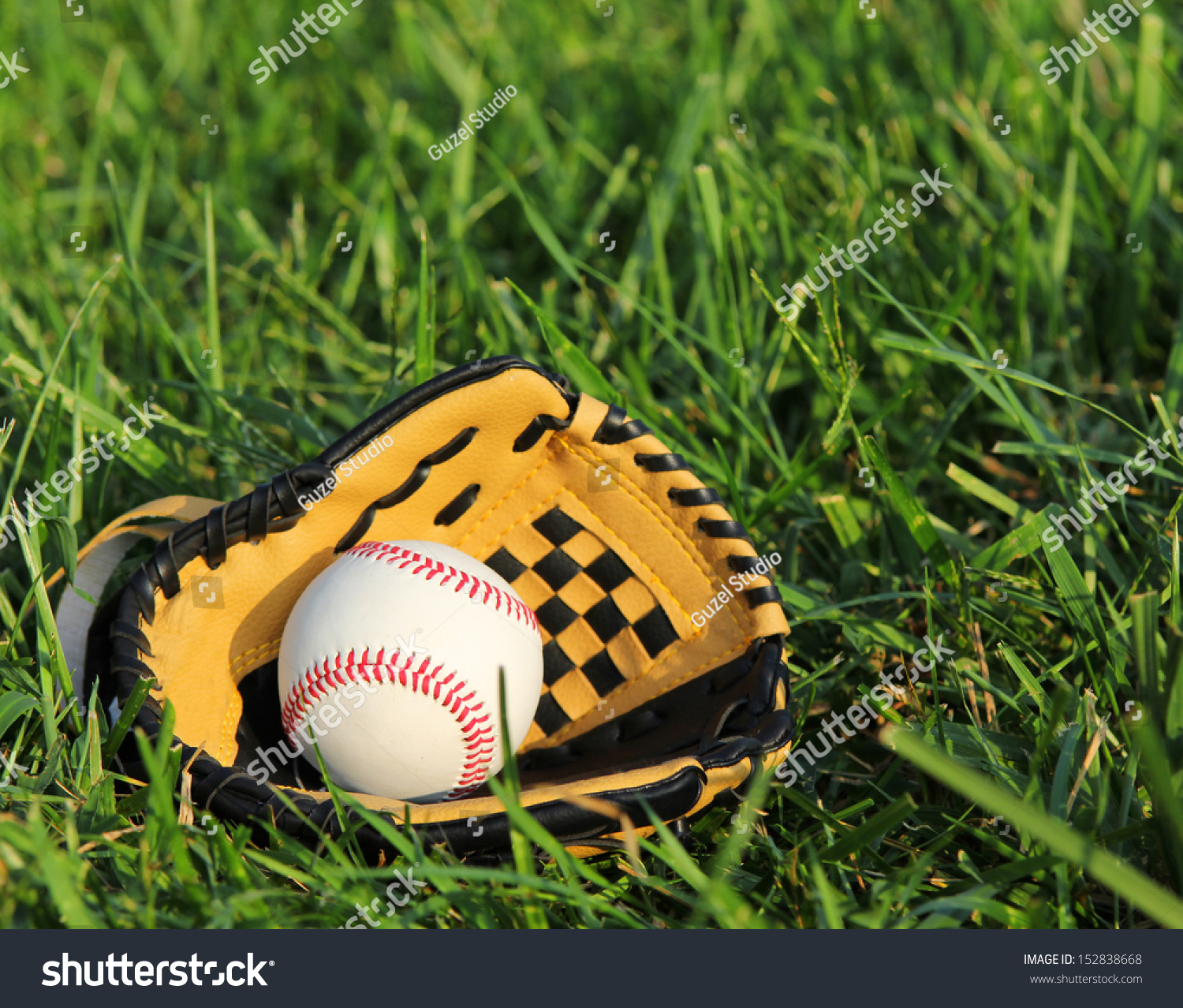 Baseball In Yellow Glove On The Green Grass Stock Photo 152838668