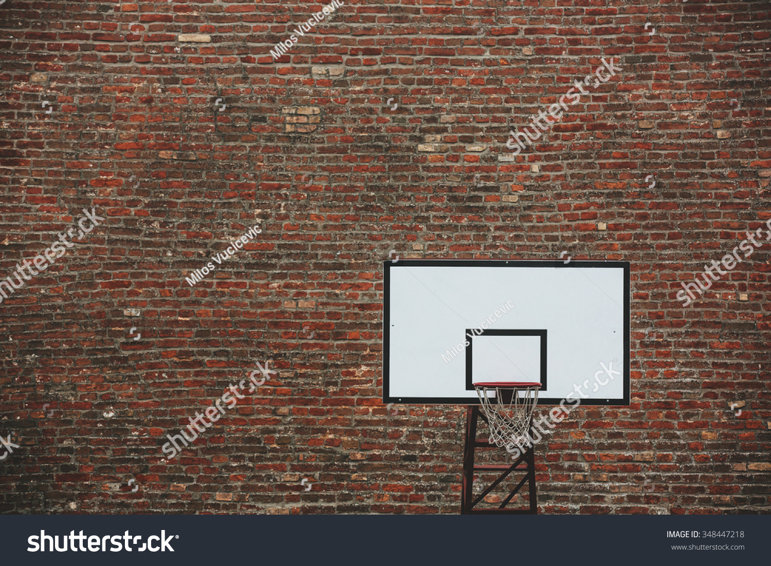 Basketball Court Outdoor In Front Of A Old Brick Wall Toned Photo