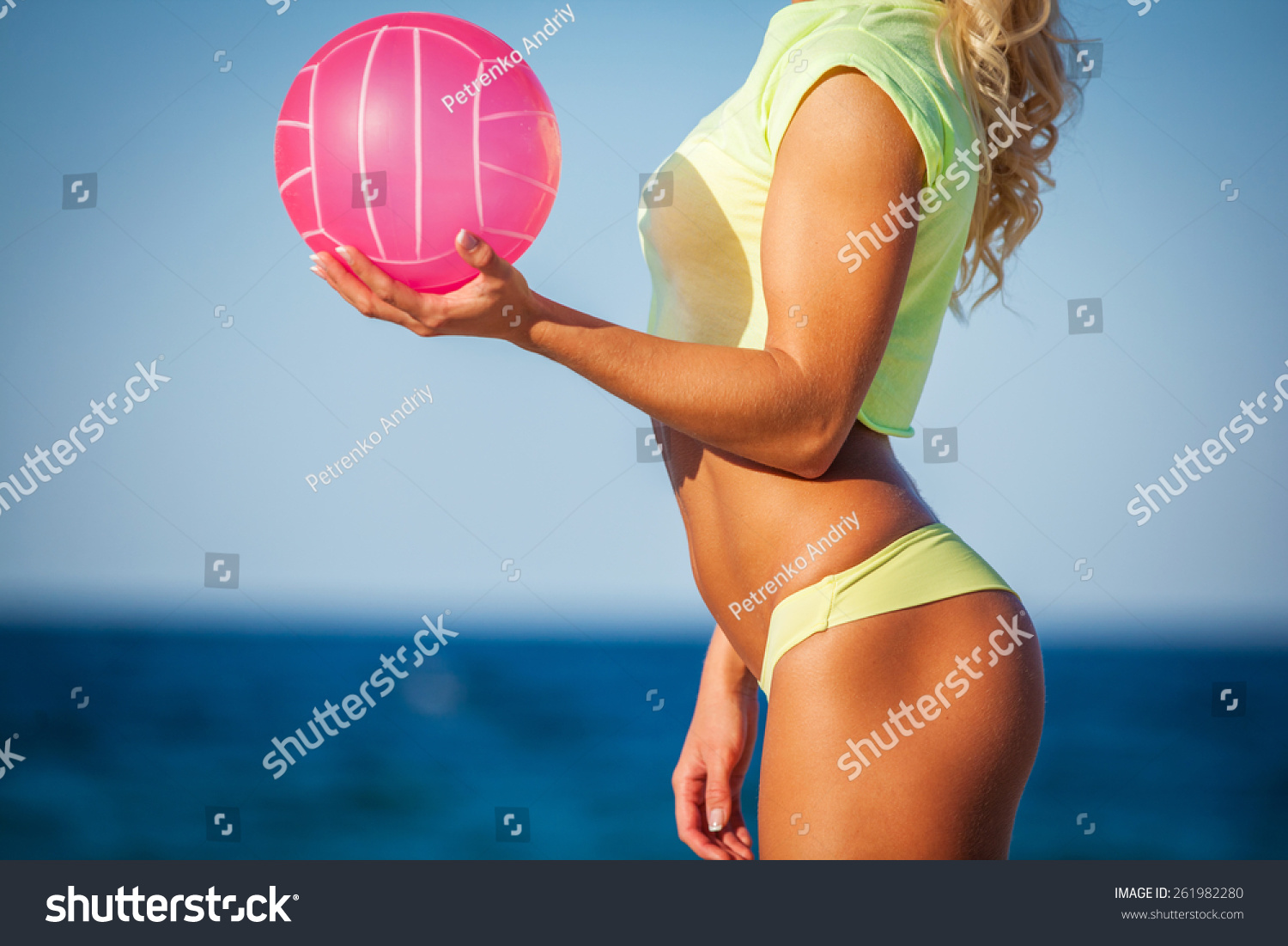 Beach Woman In Bikini Holding A Volleyball Stock Photo