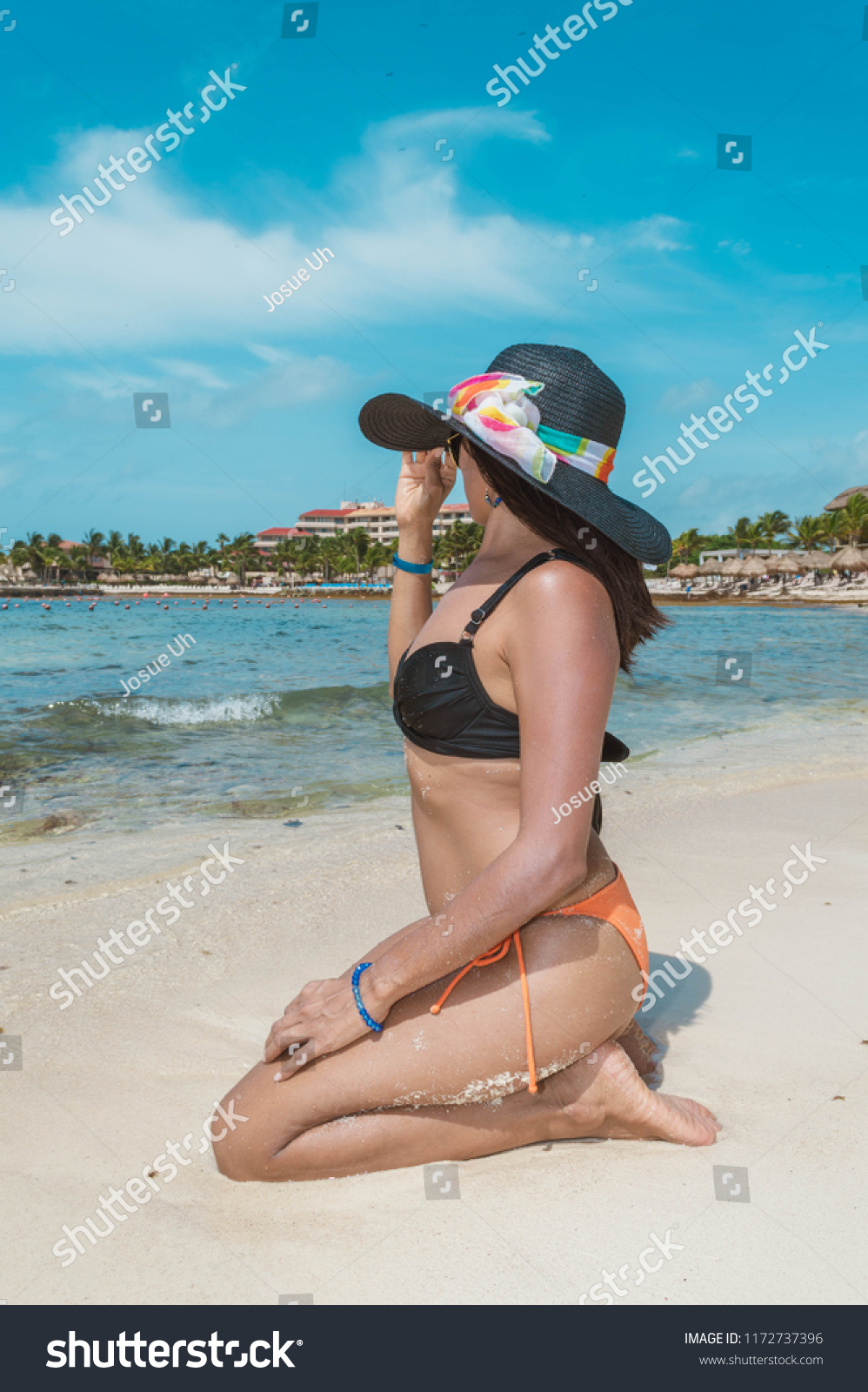 Beatiful Woman Kneeling Bikini Looking Horizon Stock Photo 1172737396