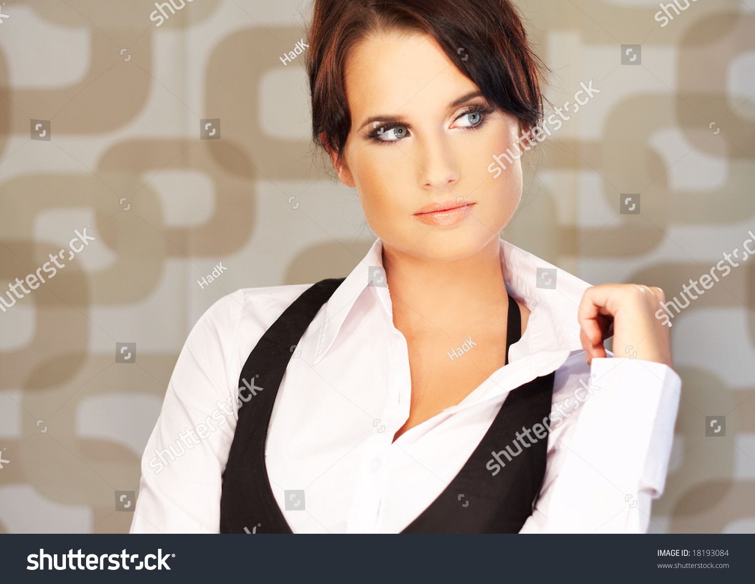 Beautiful And Sexy Brunette Business Woman On Brown Background Stock