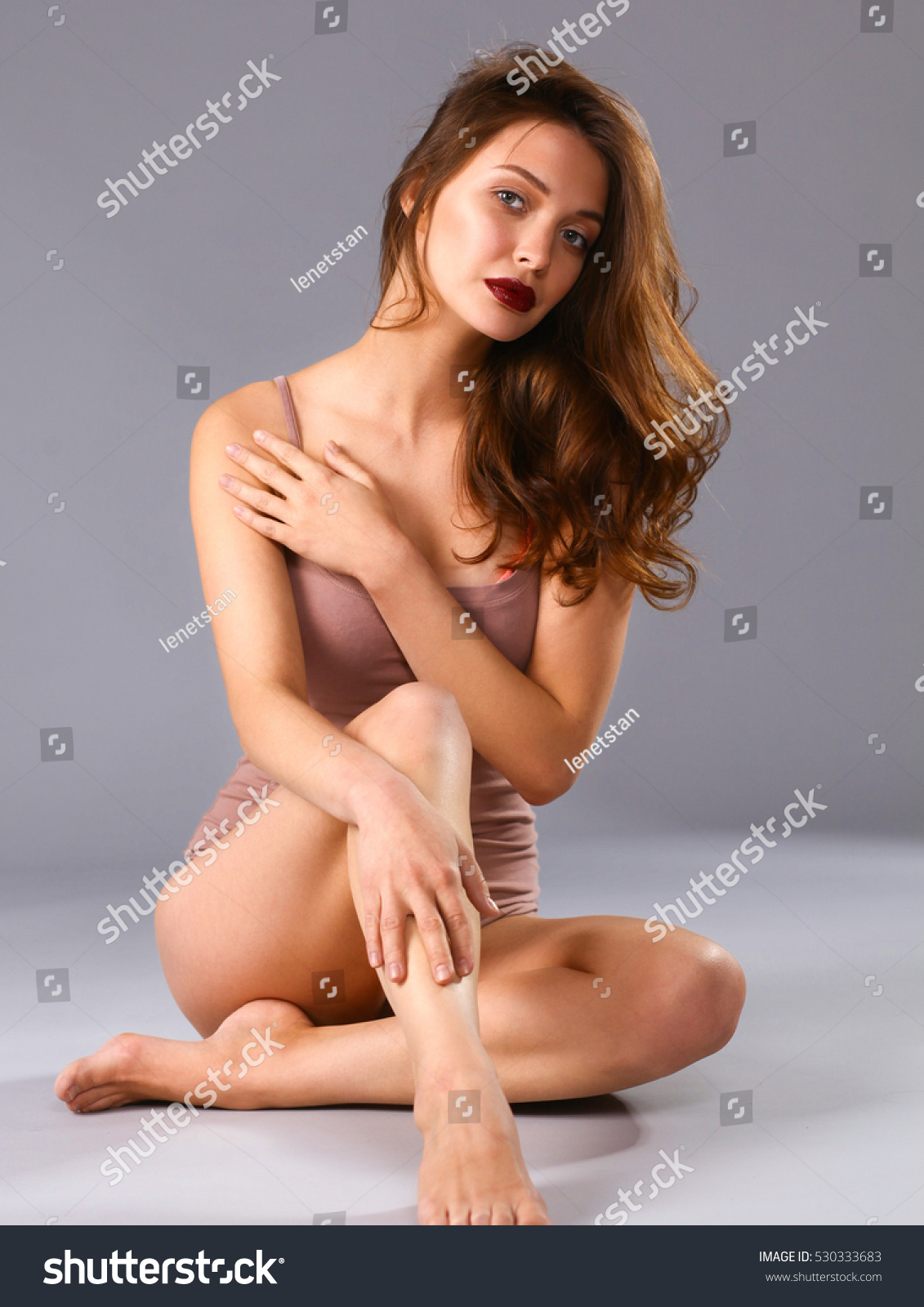 Beautiful Barefoot Woman Sitting On The Floor Stock Photo Shutterstock