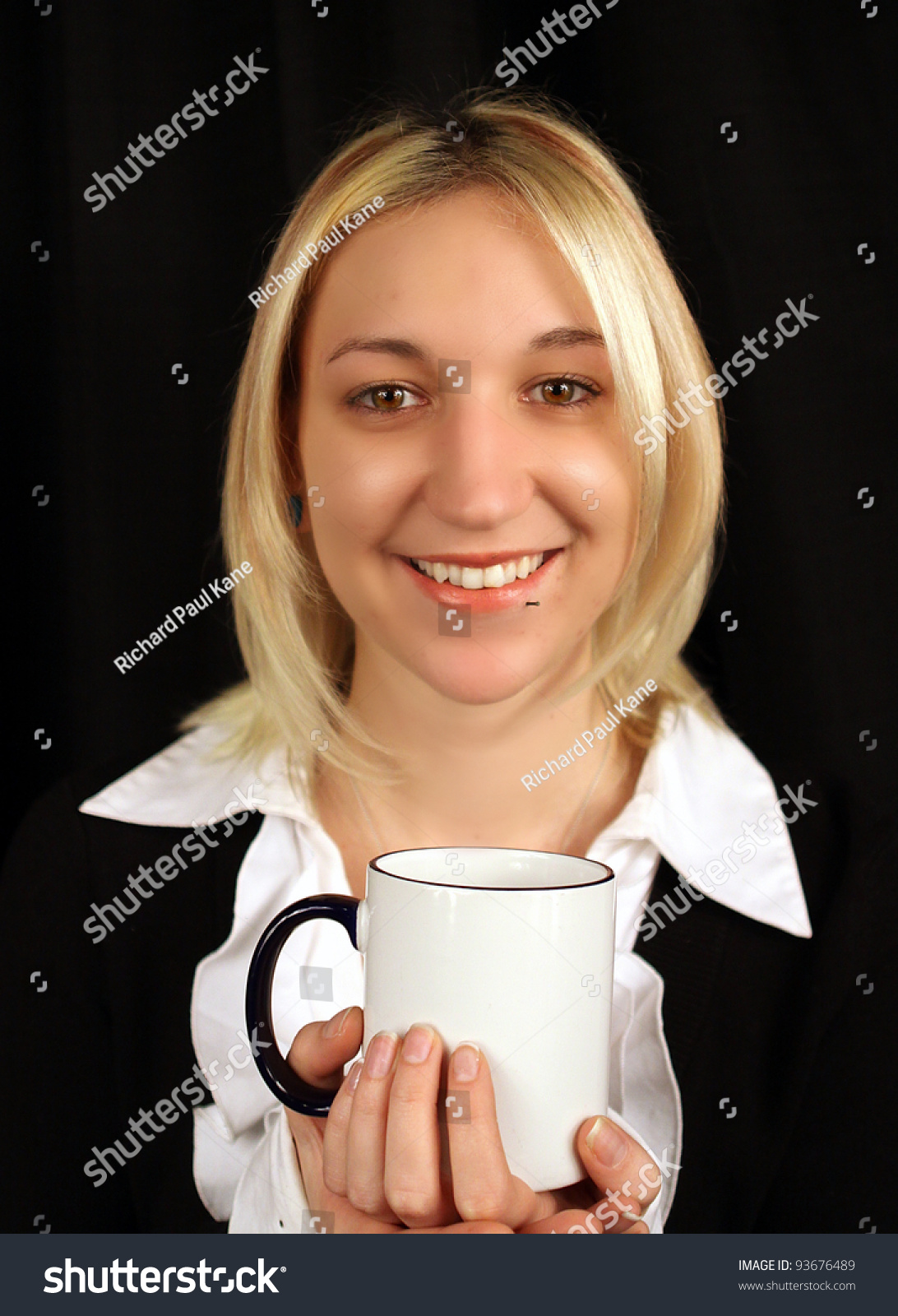 Beautiful, Blonde Business Woman Smiling Holding Coffee Mug Stock Photo