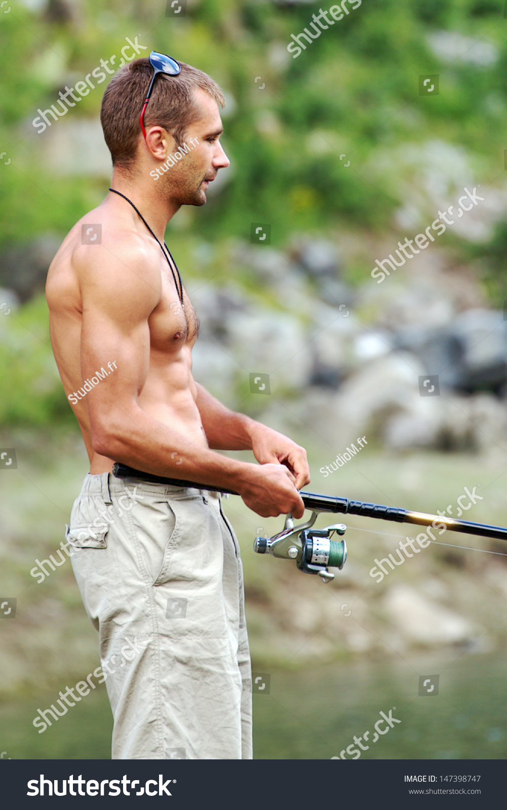 Beautiful Brawny Muscular Fisherman Naked Torso Stock Photo