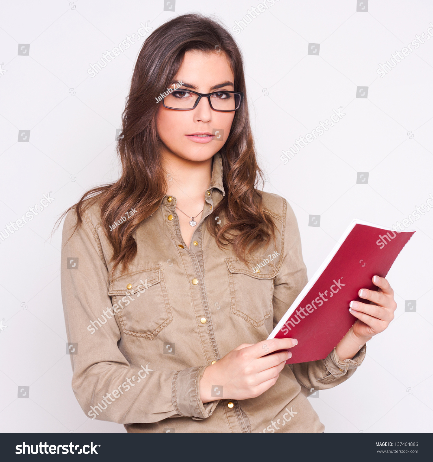 Beautiful Business Woman Looking At Papers She Smiles On White