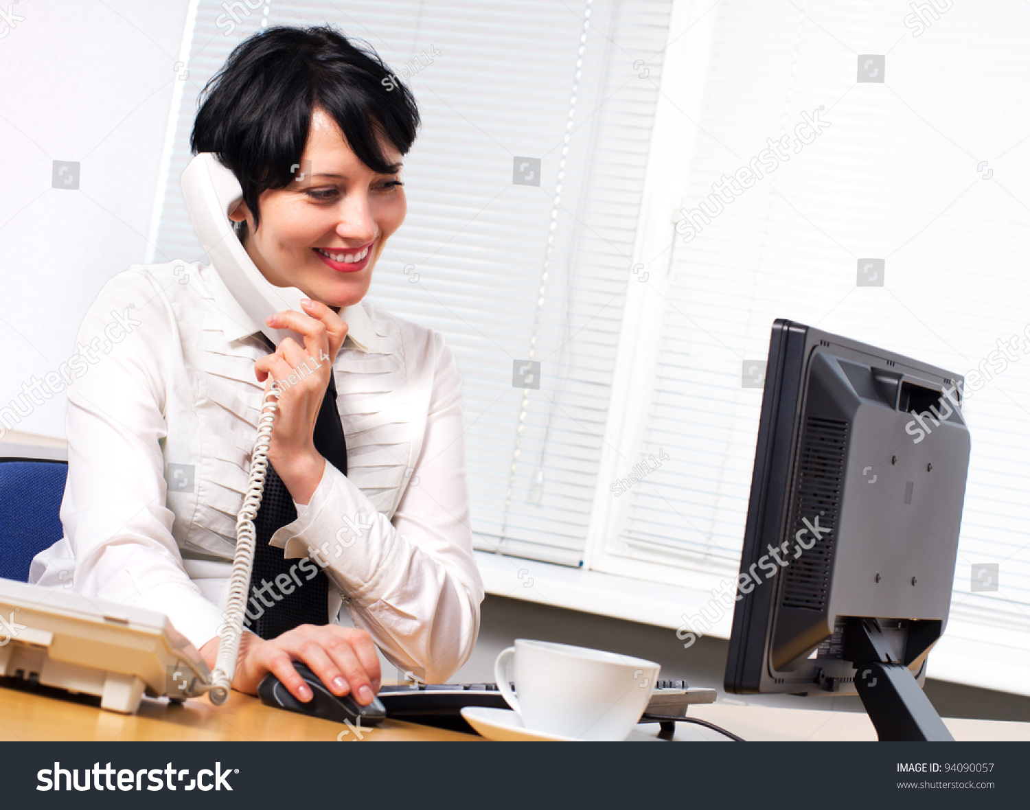 Beautiful Caucasian Brunette Businesswoman In Her Office Stock Photo