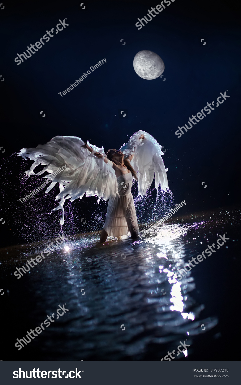 Beautiful Dancing White Angel On The Moon Background Stock Photo