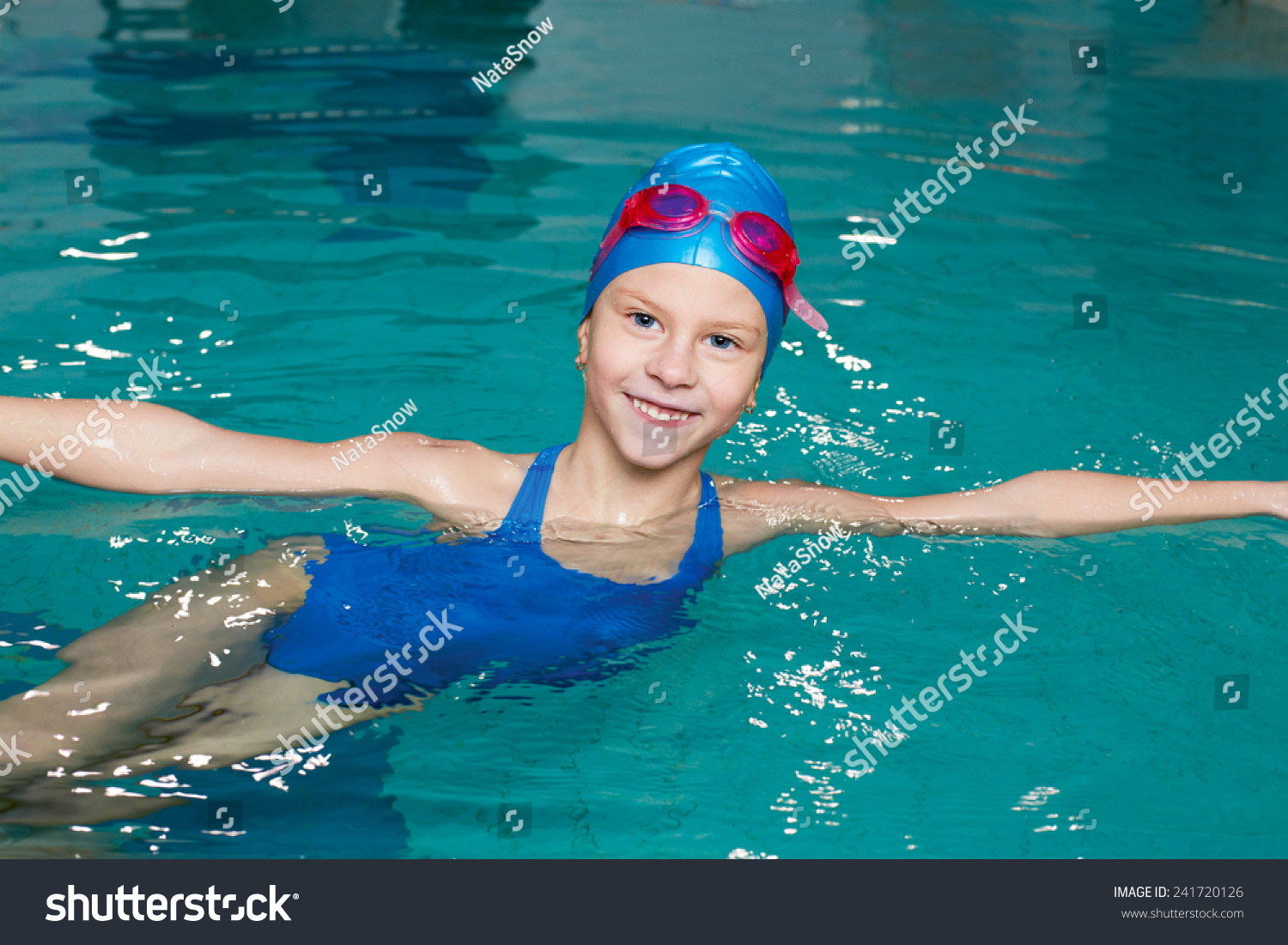 Beautiful Girl In A Bathing Suit, Swim Cap, Goggles, Holding On 