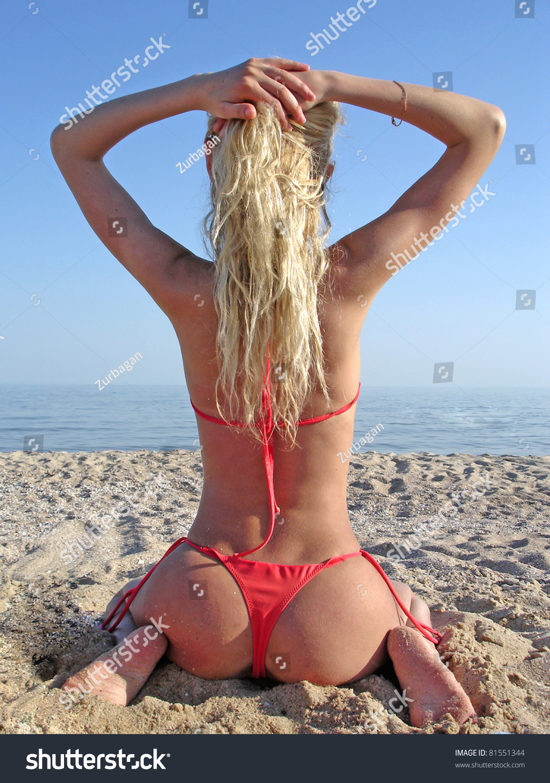 Beautiful Girl In Red Bikini On A Sea Beach Stock Photo