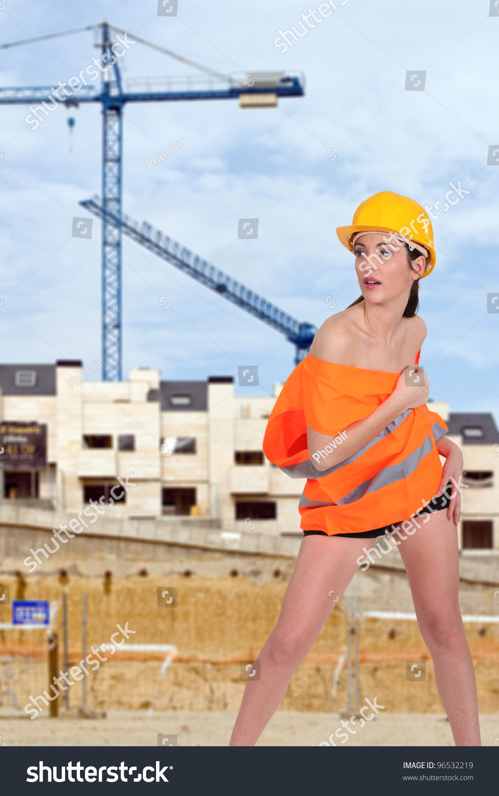 Beautiful Half Naked Woman Posing On A Construction Site Stock Photo