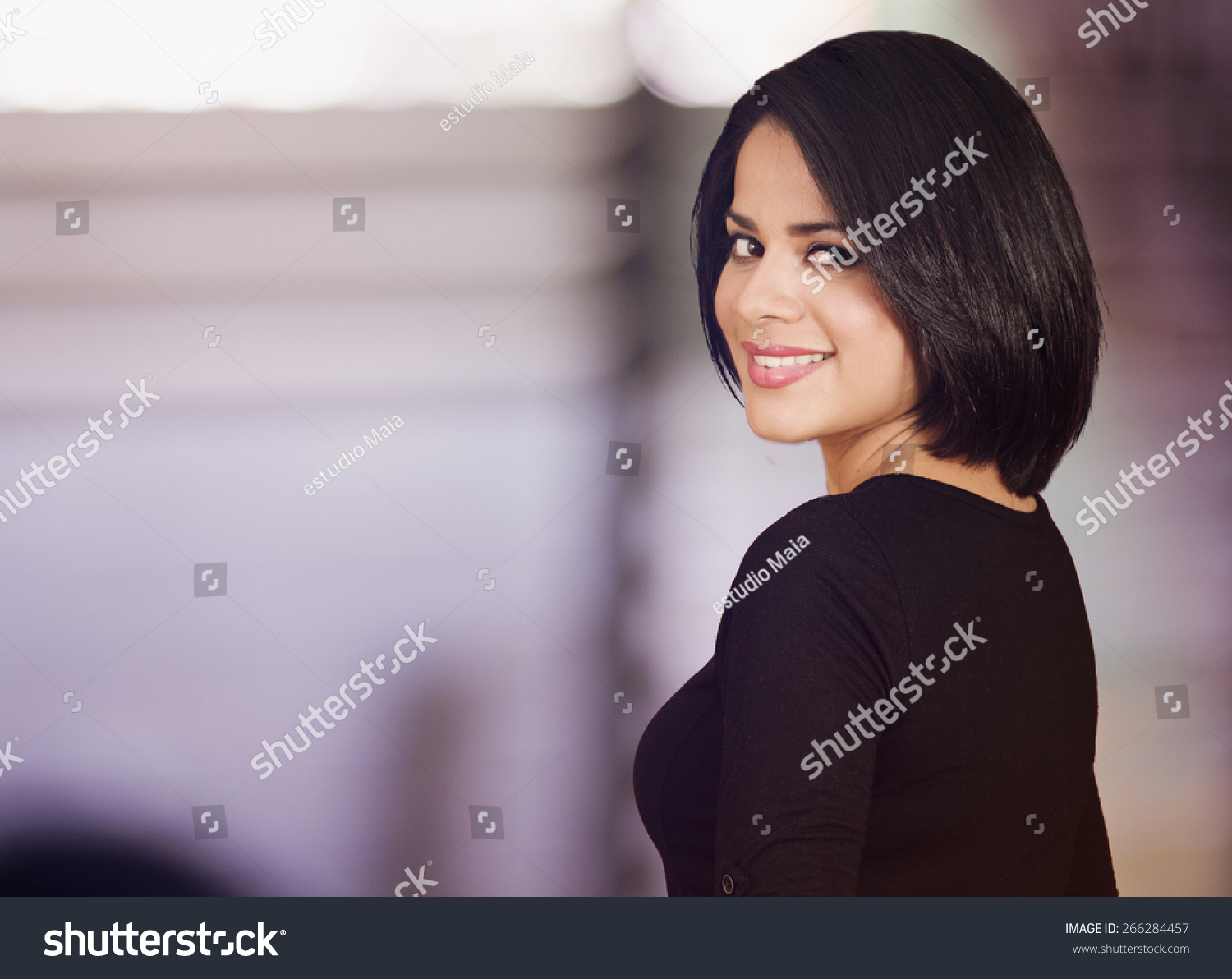 http://image.shutterstock.com/z/stock-photo-beautiful-latin-woman-looking-back-and-smiling-266284457.jpg