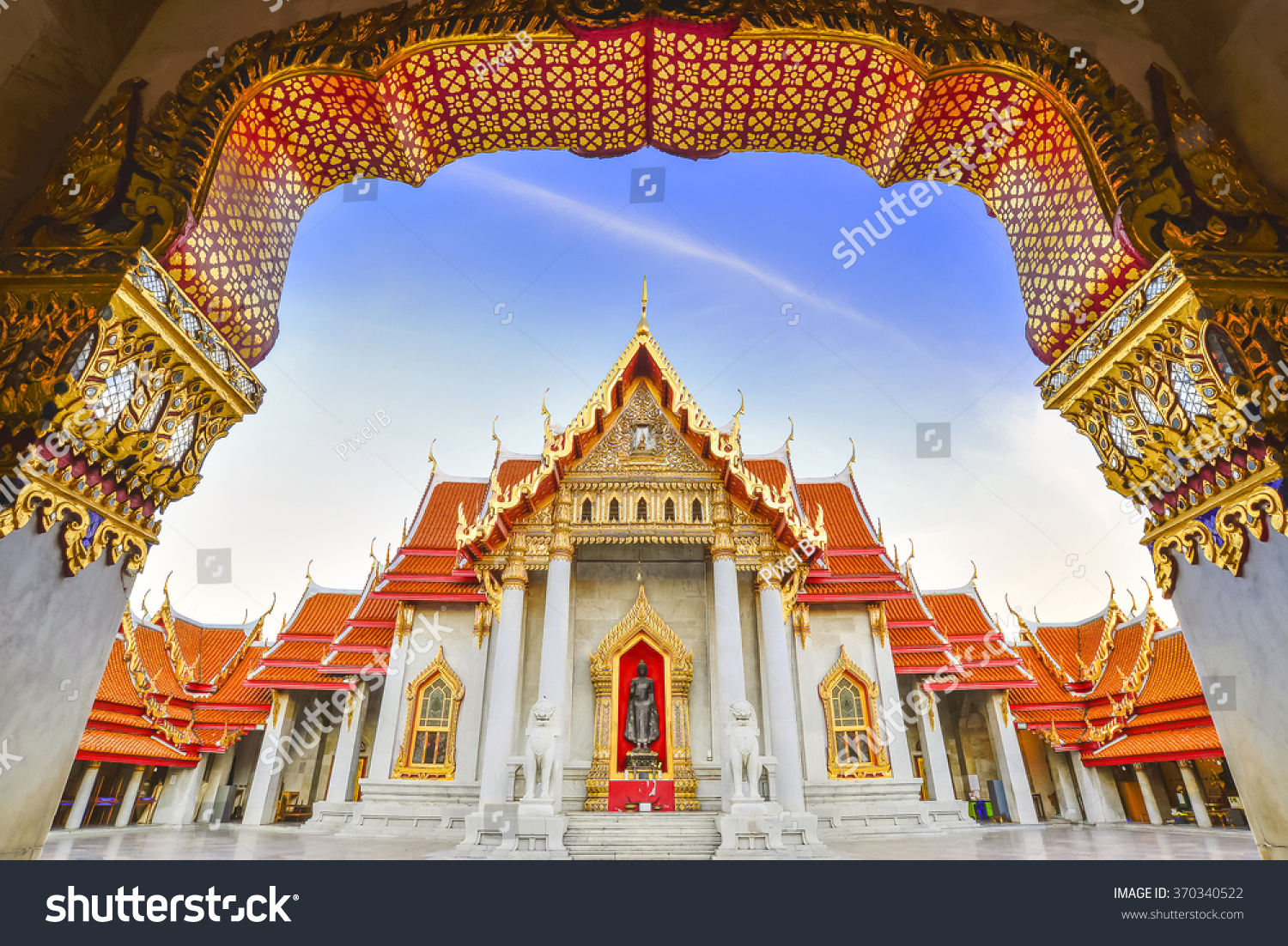 Beautiful marble temple at Bangkok city Thailand with the twilight scene from the entrance view Beautiful marble temple at Bangkok city Thailand with the twilight scene from the entrance view