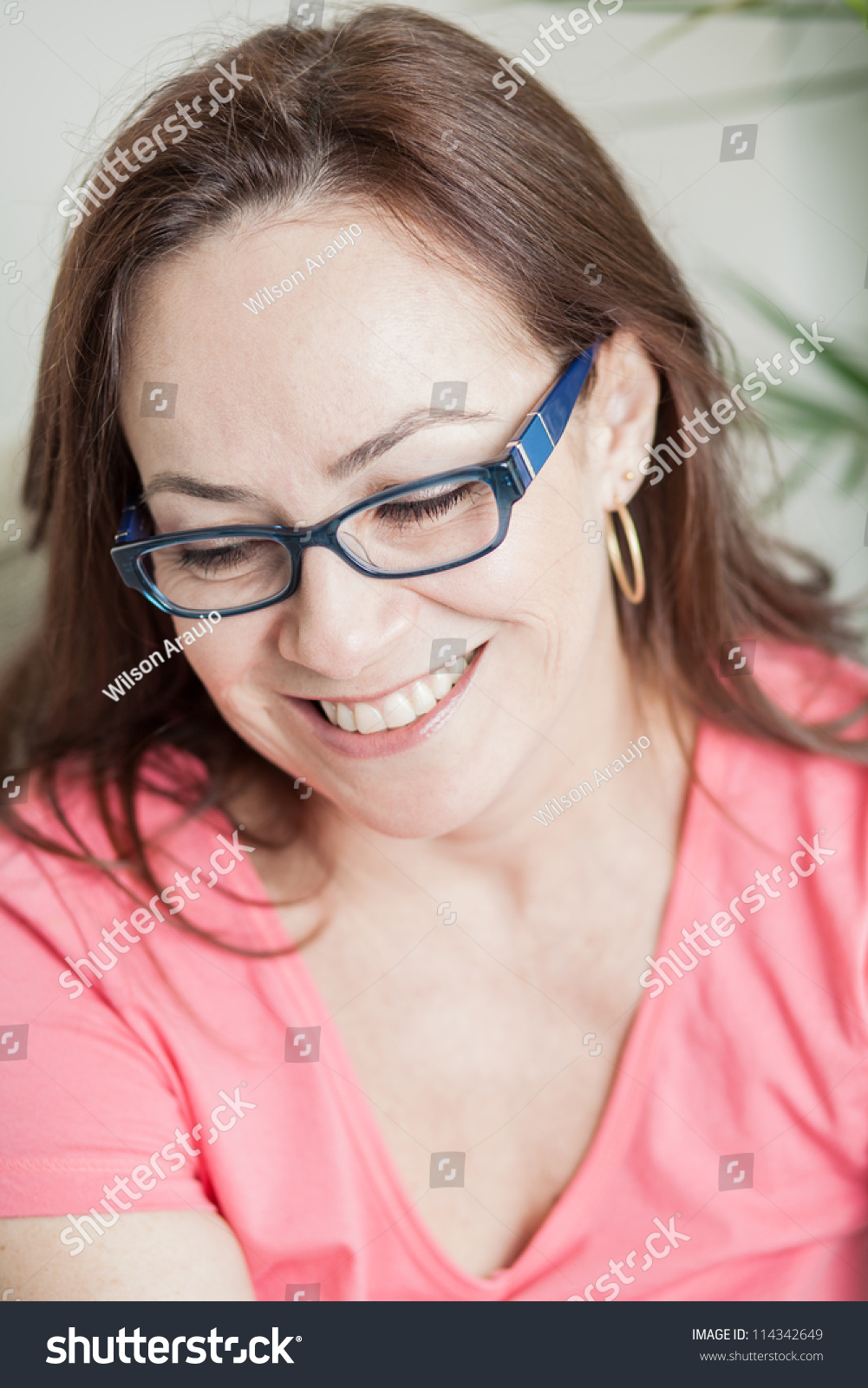 Beautiful Mature Woman Wearing Glasses Relaxing At Home