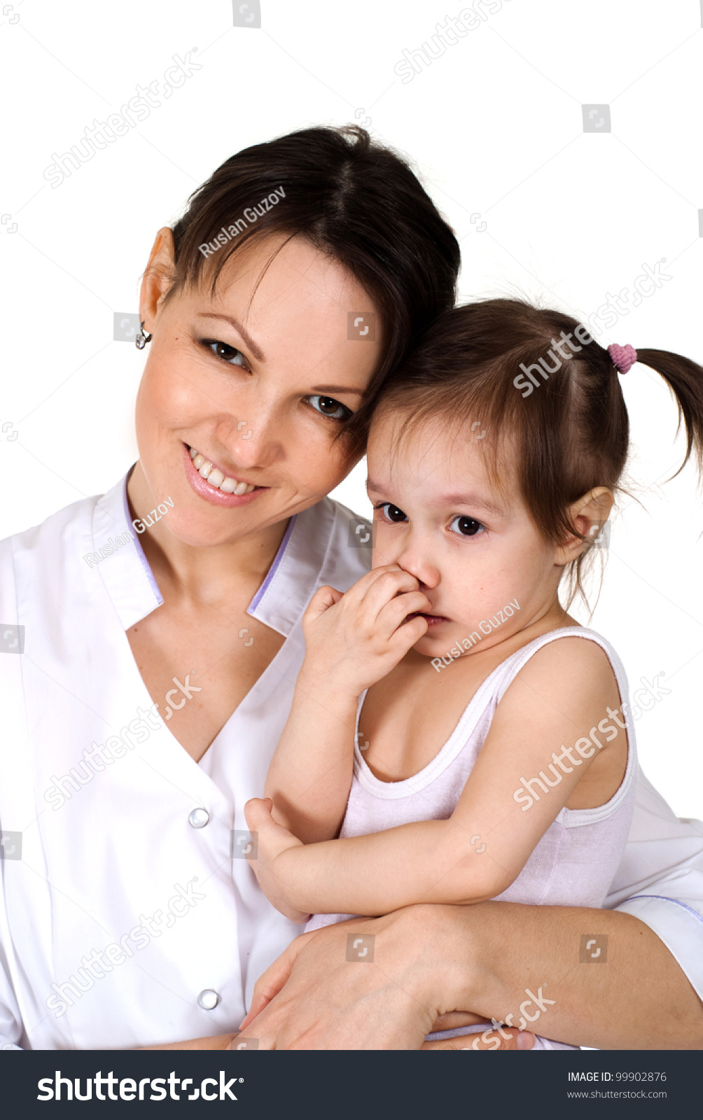 Beautiful Smiling Caucasian Nurse Holding A Baby Girl On A ...