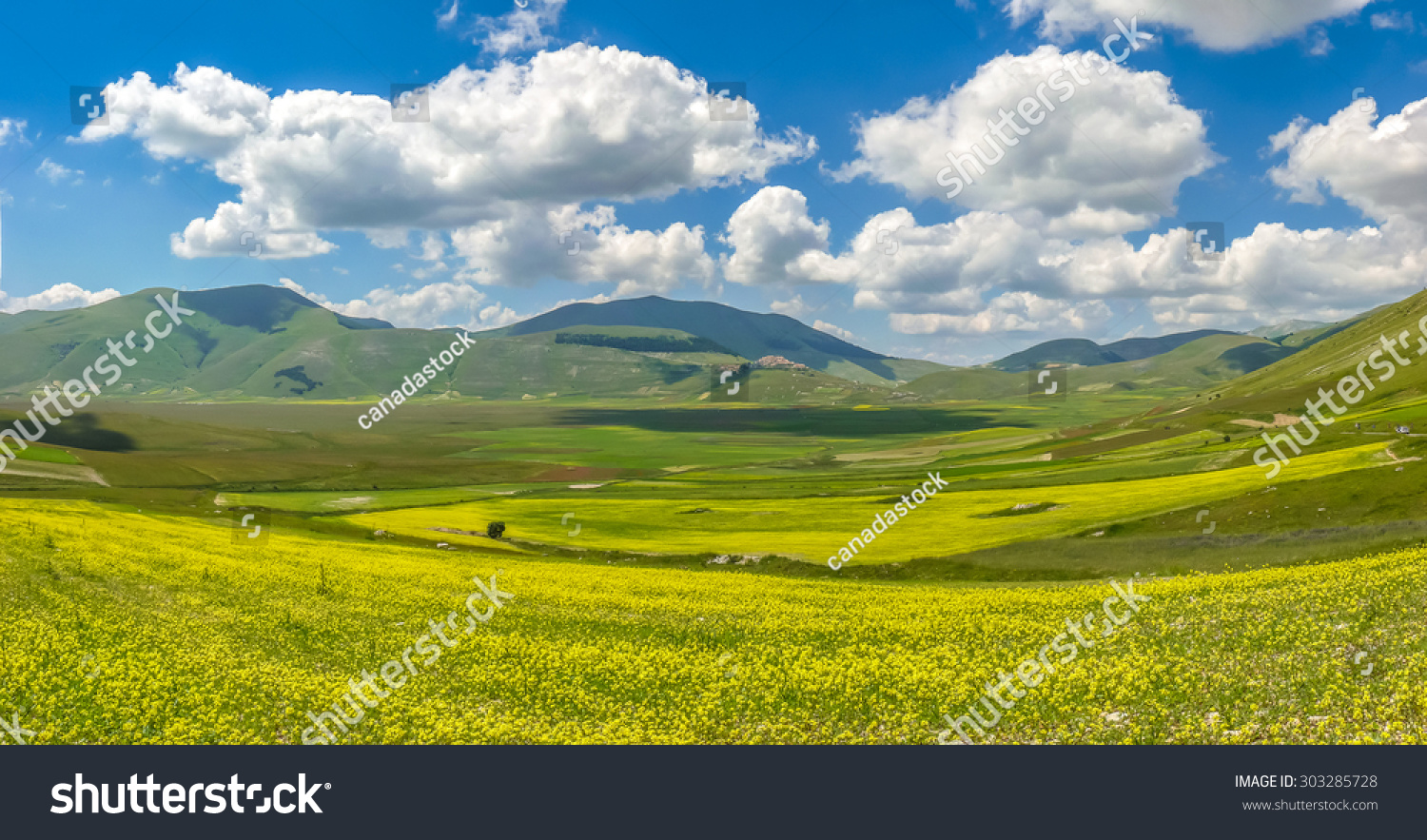 Beautiful summer landscape at Piano Grande Great Plain mountain plateau in the Apennine Mountains Castelluccio di Norcia Umbria Italy Beautiful summer landscape at Piano Grande Great Plain mountain plateau in the Apennine Mountains Castelluccio di Norcia Umbria Italy
