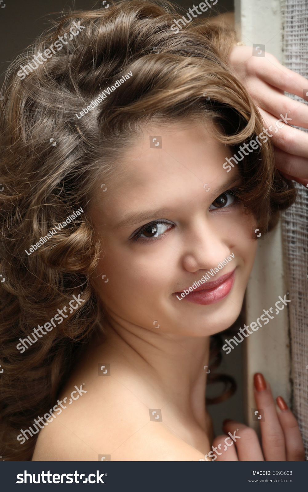 Beautiful Teen Girl With Brown Curly Hair Looking O