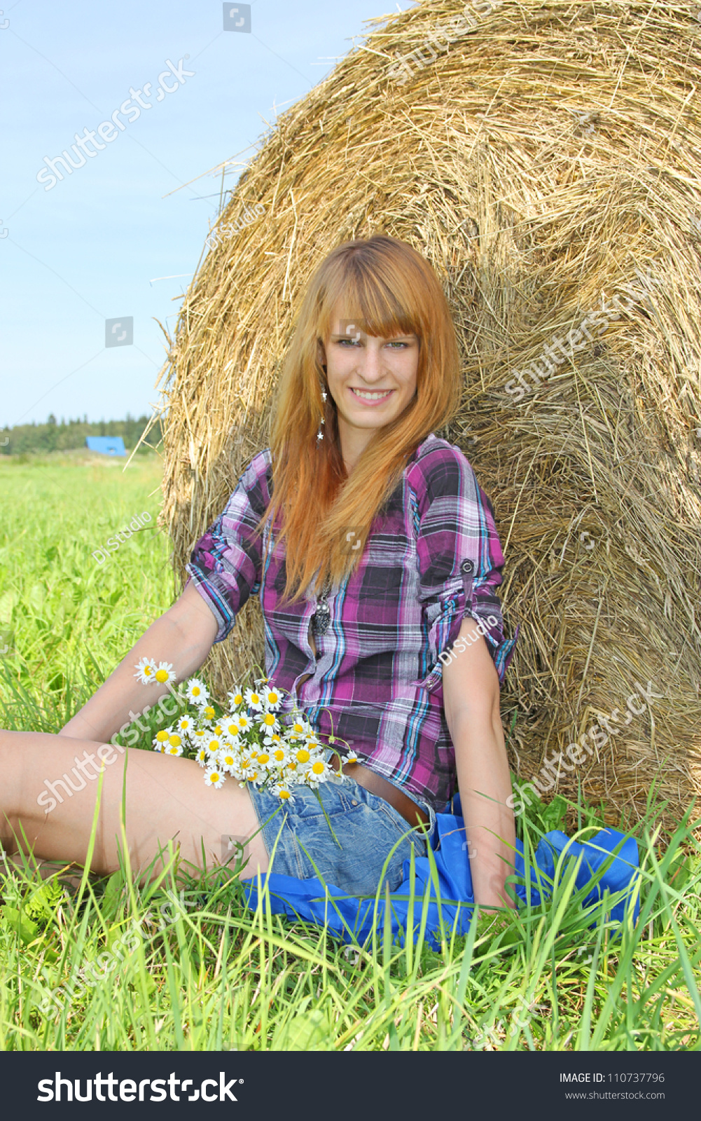 Beautiful Woman In A Field With Hay Bales Stock Photo 110737796 