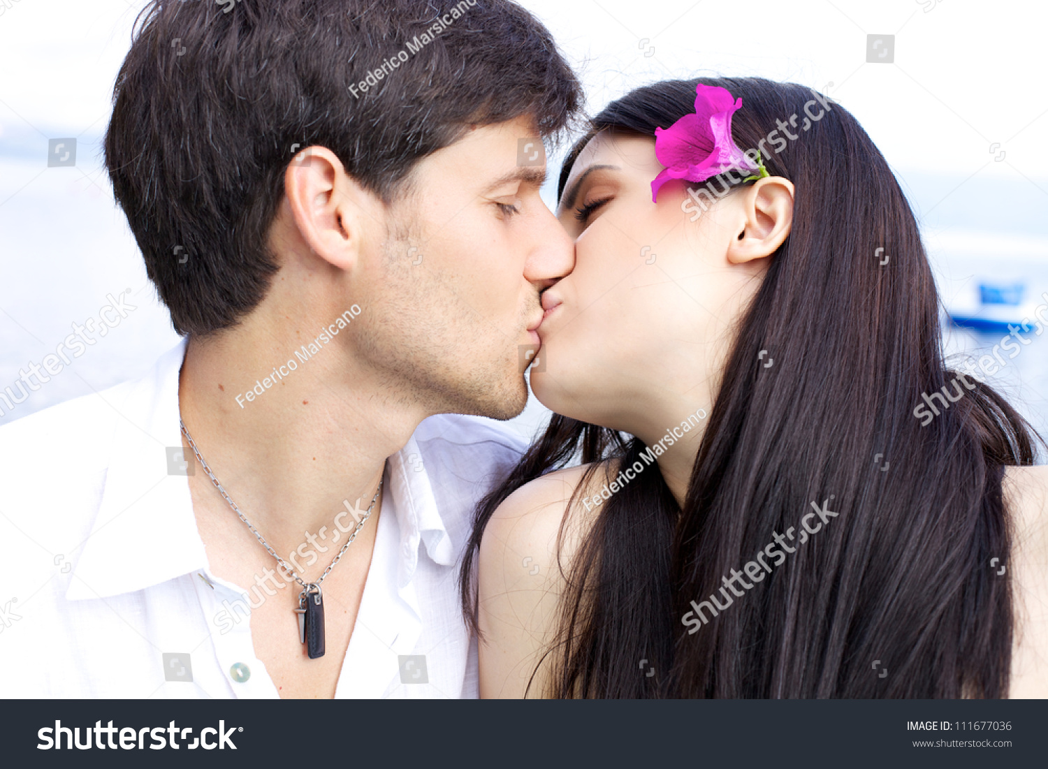 Beautiful Woman Kissing Her Boyfriend With Flower In He