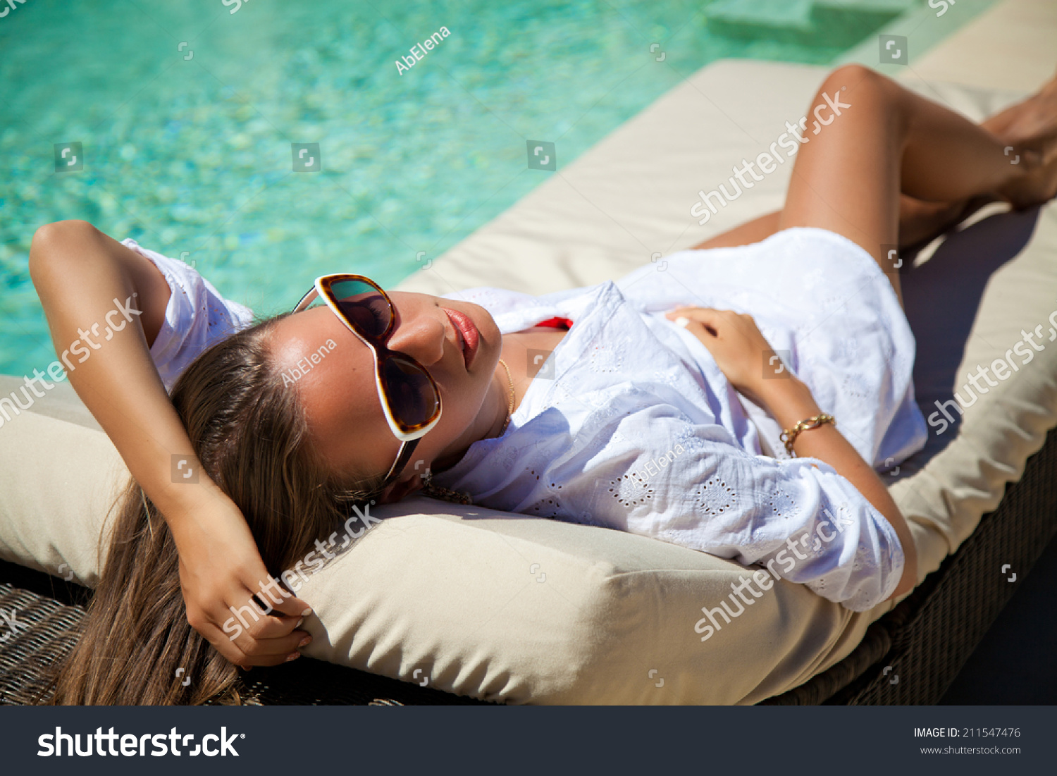 Beautiful Woman Smiling Lying On Sun Chaise Lounge Near Luxury Pool Side Young Woman Enjoying