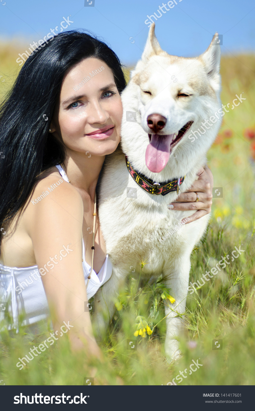 Beautiful Woman With Husky Outdoors.Happy Brunette Woman With Smiling