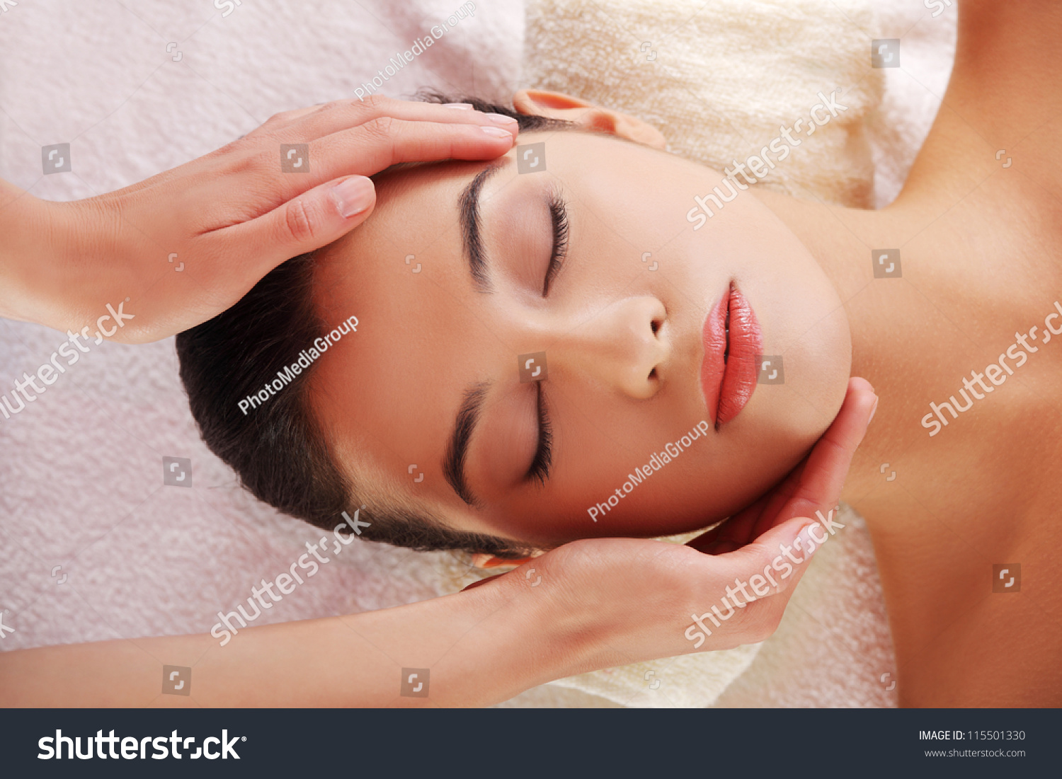 Beautiful Young Relaxed Woman Enjoy Receiving Face Massage At Spa