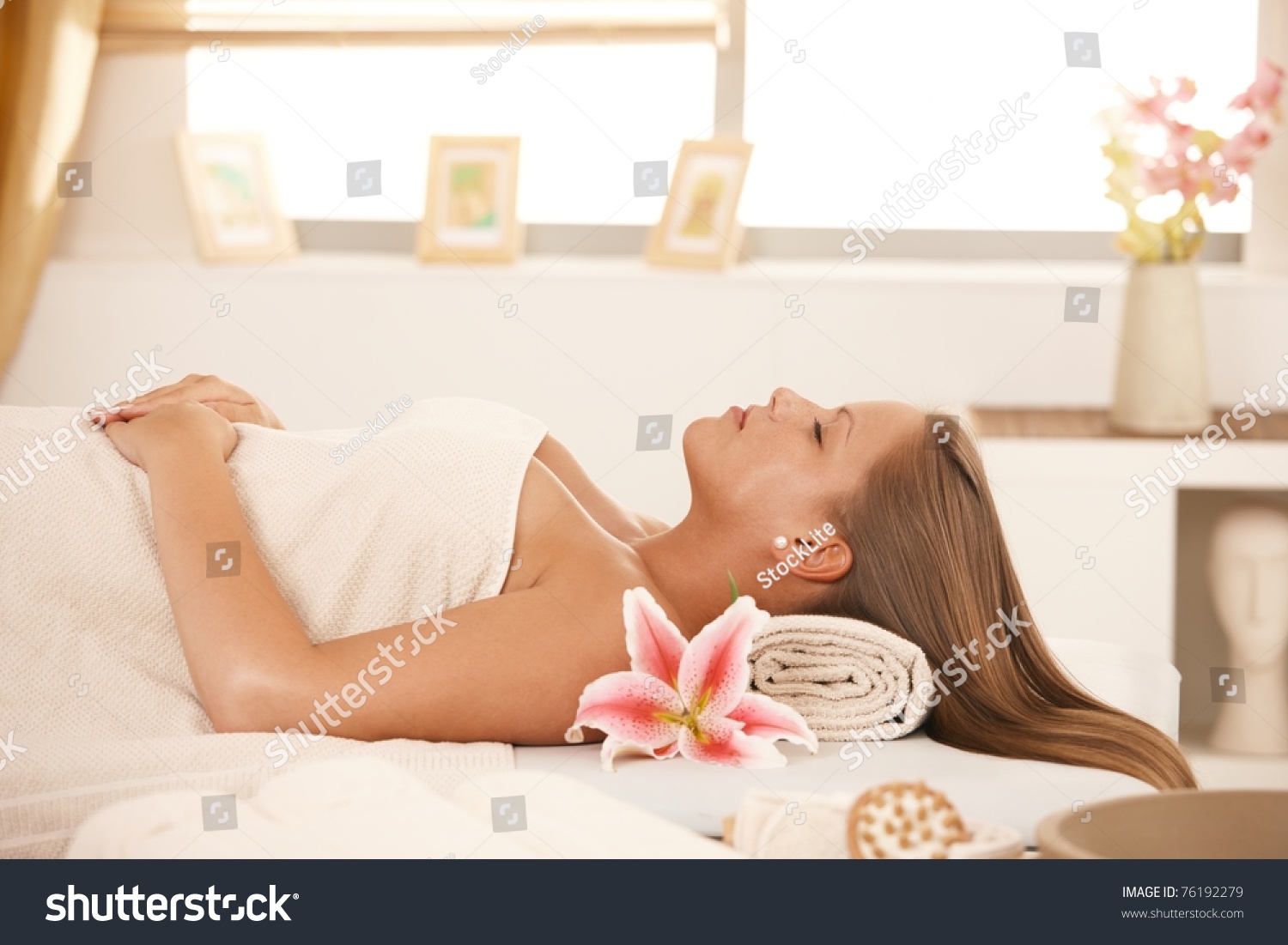 Beautiful Young Woman Lying On Massage Bed At Spa Sleeping Stock