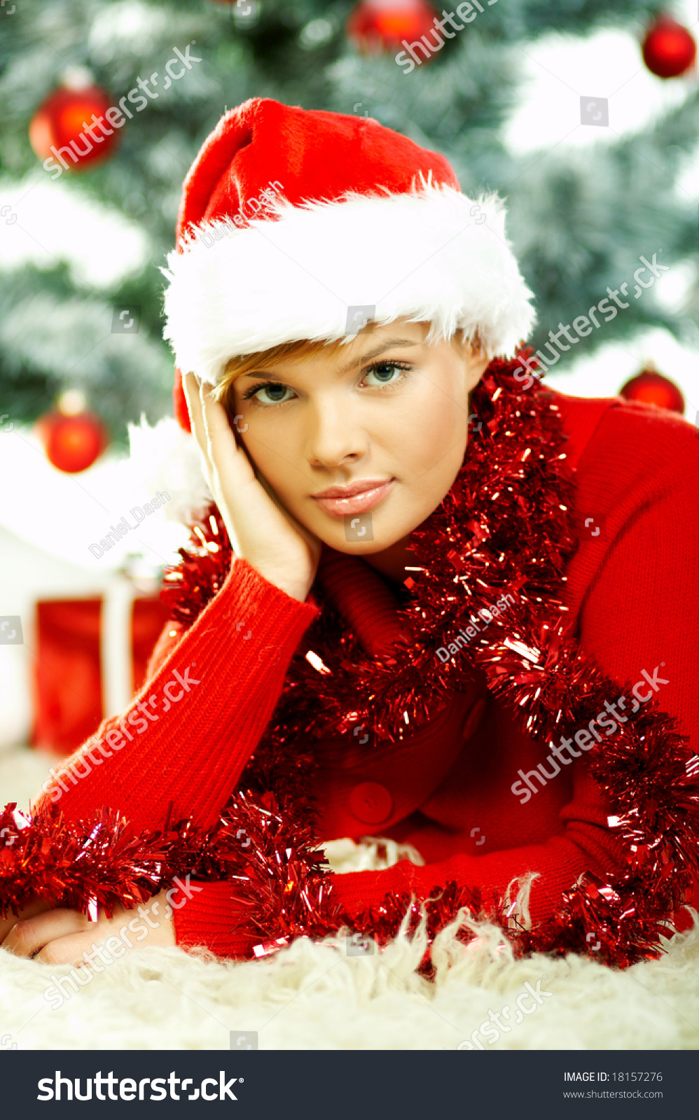 beautiful young woman wearing santa hat next to christmas beautiful young woman wearing santa hat next to christmas