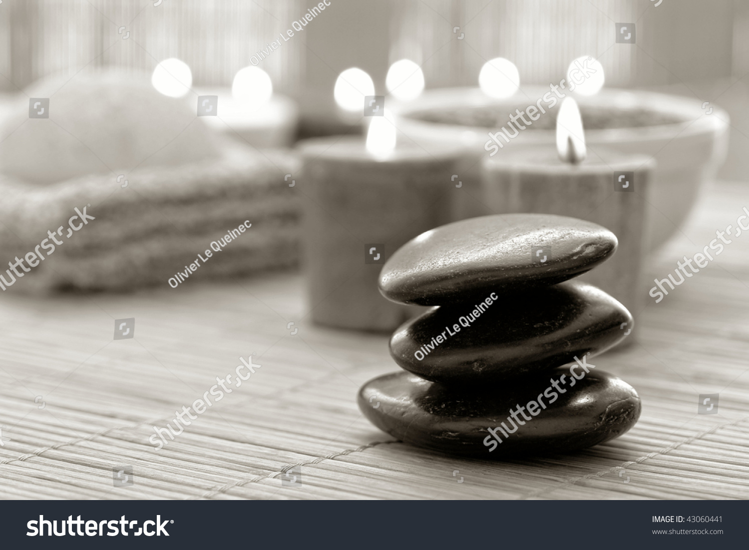 Black Polished Hot Massage Stone Cairn With Burning Candles For A