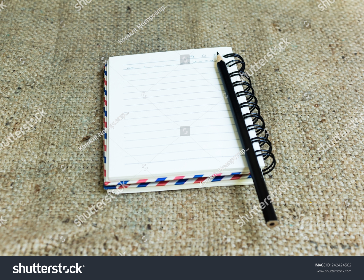Blank notebook with pencil on sack background Vintage effect style pictures Blank notebook with pencil on sack background Vintage effect style pictures